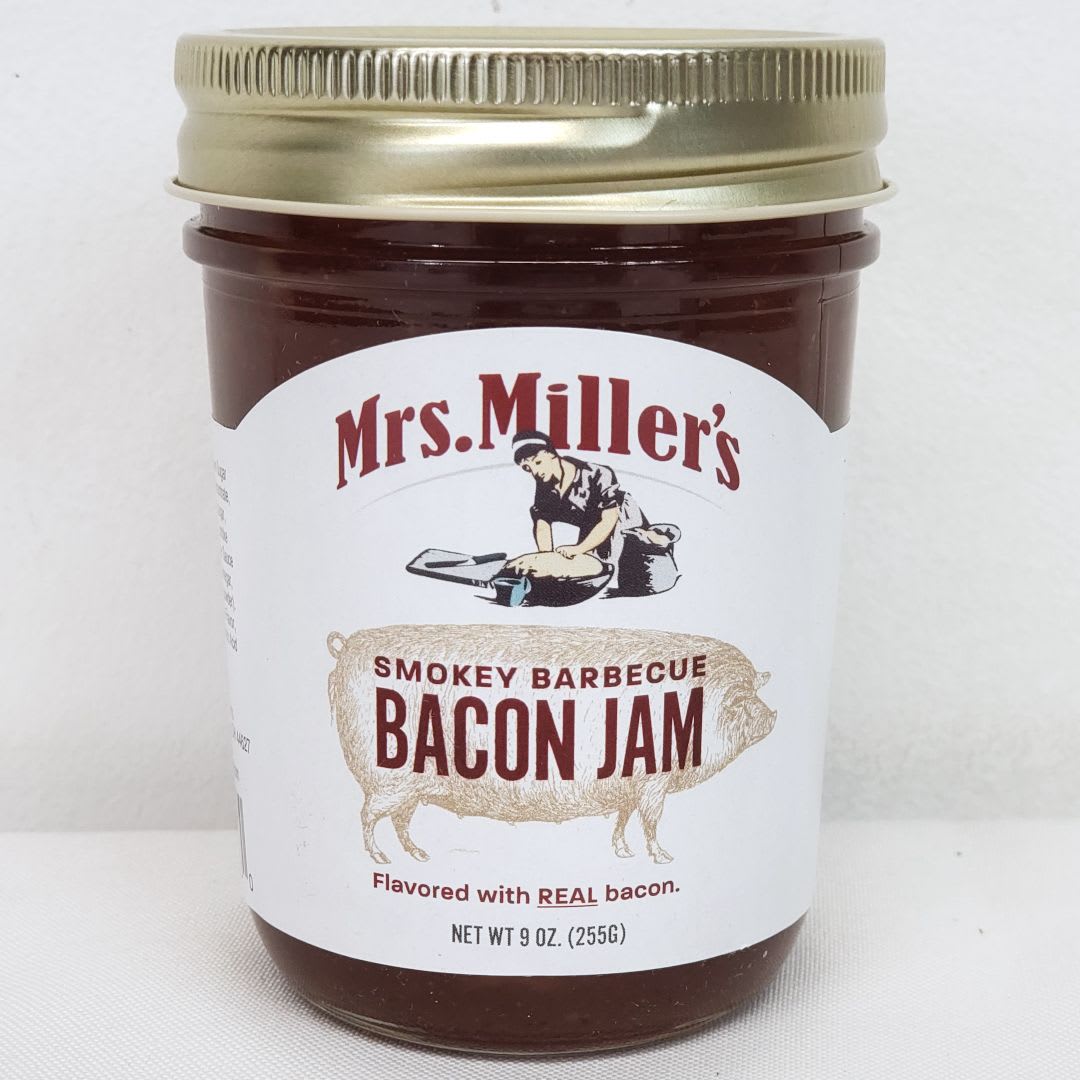 Smokey BBQ Bacon Jam (9 oz) - Nothing tastes better on a burger than a generous helping of Mrs. Miller's Homemade Smokey Barbecue Bacon Jam.  Made with real chunks of bacon, this sweet bacon flavored jam will transform your next grilling party.  It also tastes great with deli sandwiches, eggs, and crackers.