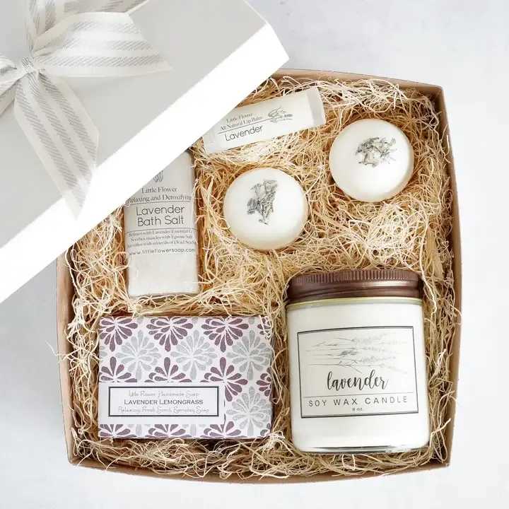 Luxury Lavender Spa Gift - Ready to Gift Luxury Spa Box Measures 8 x 8 and comes in a white gift box with an organic cotton grey and white stripe bow (as pictured).  Perfect for all those last minute customers. Choose from Standard "Lavender" candle label or "Love You Mom" candle label.  INCLUDES: 1 - 6oz BIG soap Lavender Lemongrass 1 - Lavender Lip Balm 1 - 4oz Lavender Bath Salt with Dead Sea Salt and Epsom 2 - 2oz Lavender Bath Bombs topped with rose petals 1 - 8oz Lavender Candle - select either general “Lavender” or “Love You Mom” label for candle 1 - White gift box with Grey and Ivory Organic Cotton striped Ribbon