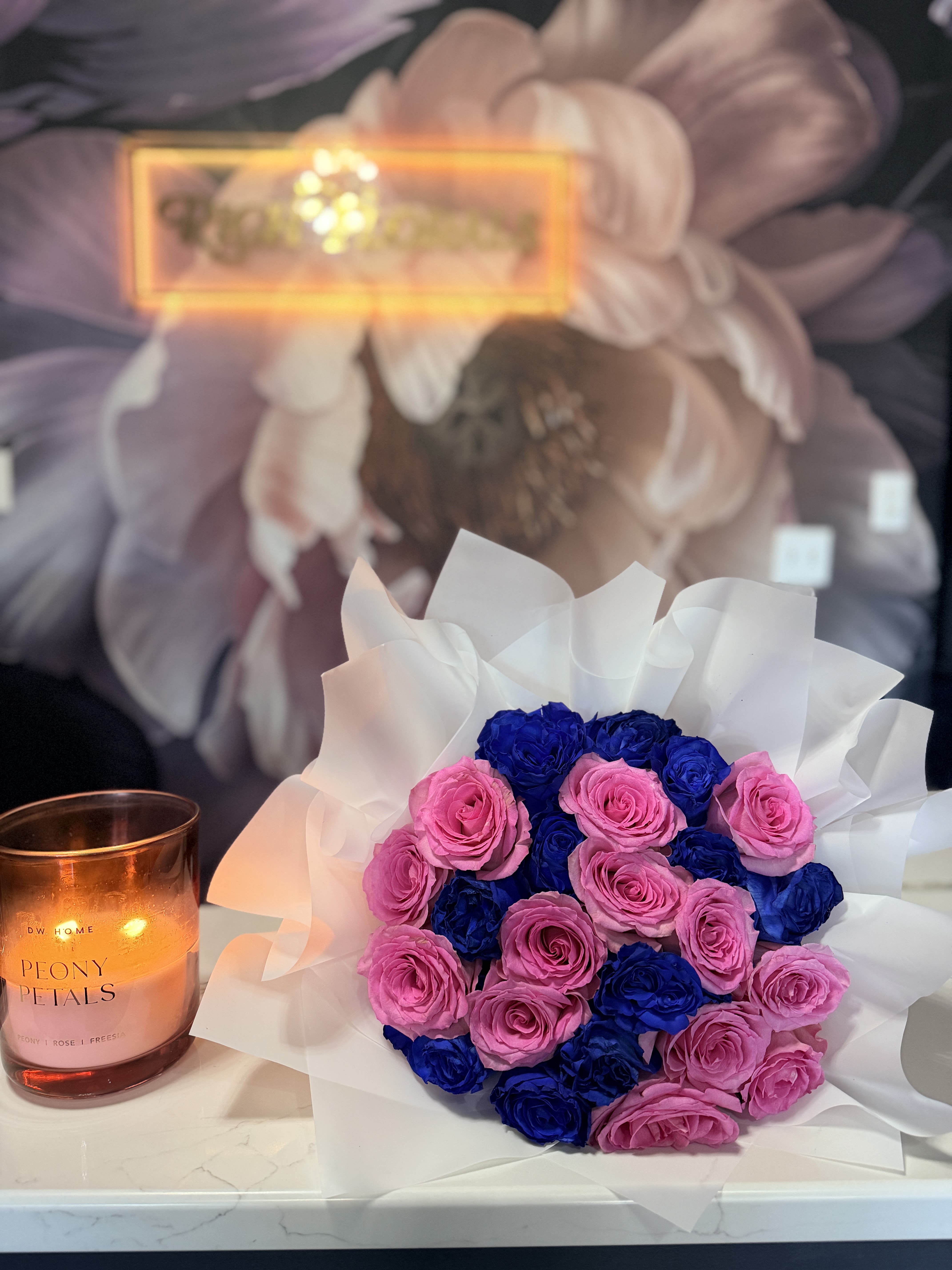 Luxe for Less Bouquet - Only One, Available Now  Grab this stunning arrangement while you can! This one-of-a-kind bouquet features 26 gorgeous pink and blue roses, ready for immediate pickup or delivery.  These roses aren't quite as fresh as our signature preorder bouquets, but they're still absolutely beautiful and have plenty of life left to brighten someone's day. That's why we've discounted this arrangement - so you can enjoy Rich Florals luxury at an unbeatable price.  Perfect for last-minute gifts or treating yourself without breaking the bank. Once it's gone, it's gone!