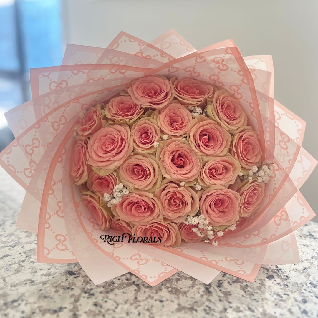 Sweet Geraldine Bouquet - Standard: 25 roses, gucci floral wrap, light baby's breath Premium: Baby's Breath Name (up to 8 letters) 25 roses, gucci floral wrap, light baby's breath