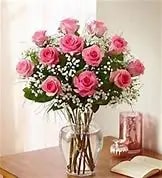Perfectly Pink Roses - One Dozen Pink Roses Arranged in a Vase with Baby's Breath and Greens.