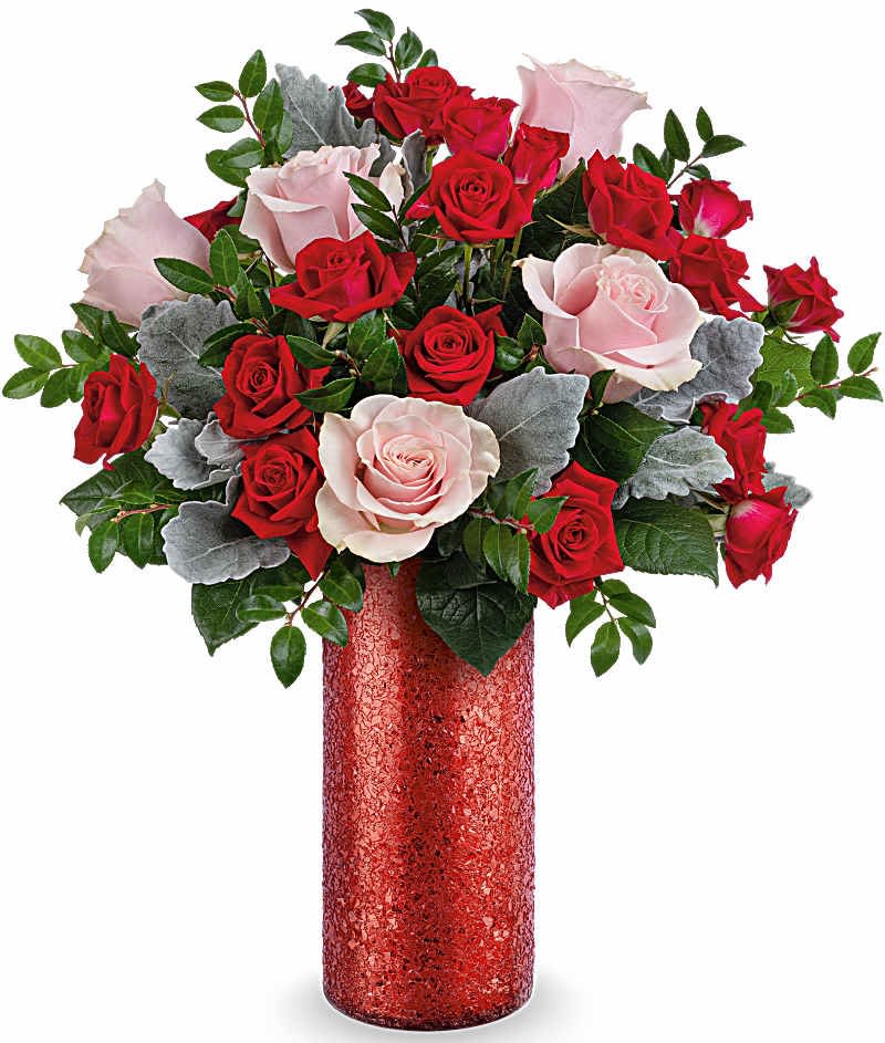 Teleflora's Boldly Beautiful Bouquet - Teleflora's Boldly Beautiful Bouquet includes pink roses, red spray roses, and dusty miller, beautifully arranged in Teleflora's Boldly Beautiful Vase.  Orientation: All-Around