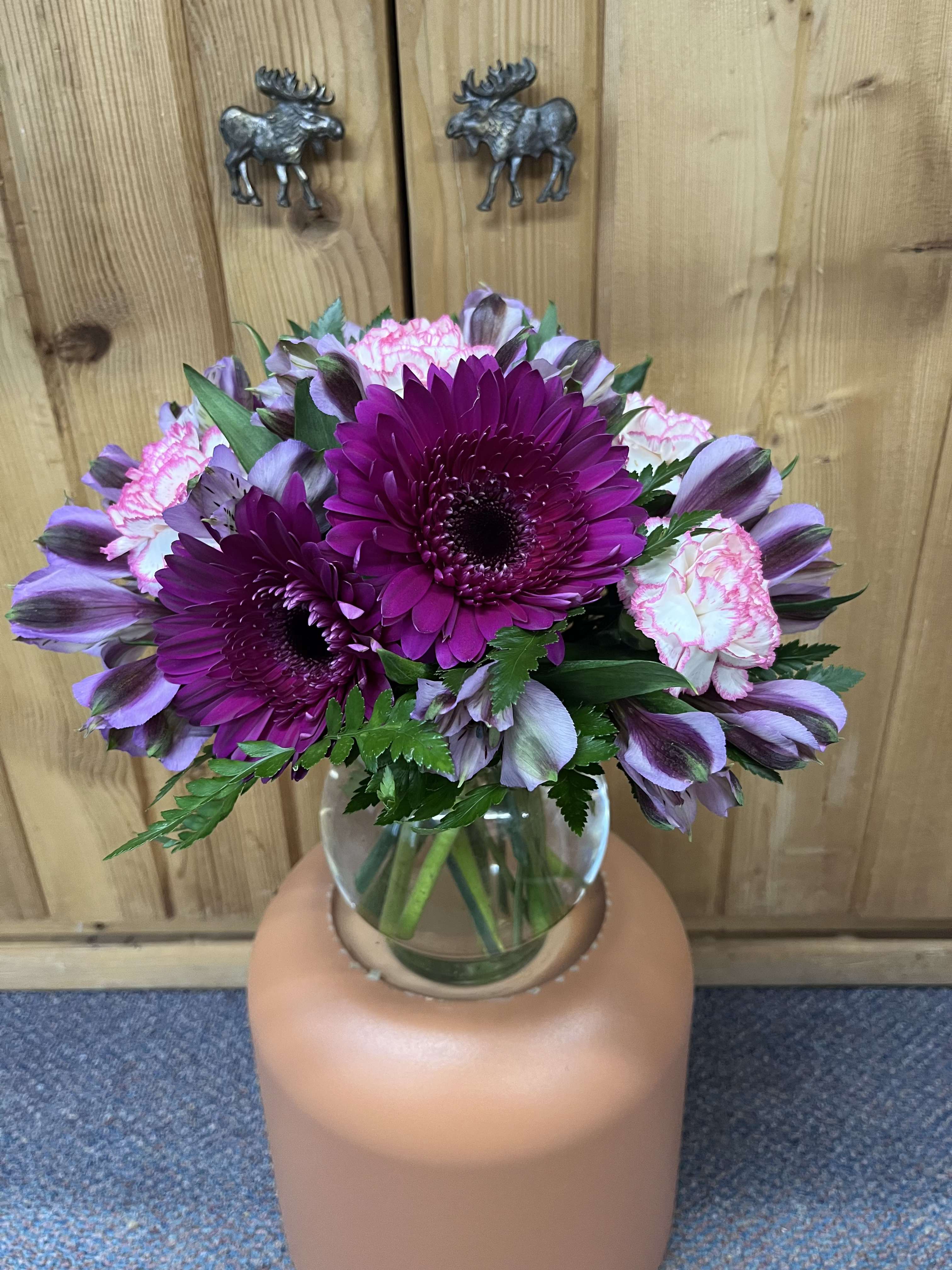 Purple Passion  - Need a little pick me up?  Purple Passion is simple and sweet but just right! This beautiful arrangement features the long lasting flowers alstroemeria, carnations, and gerbera daisies. 