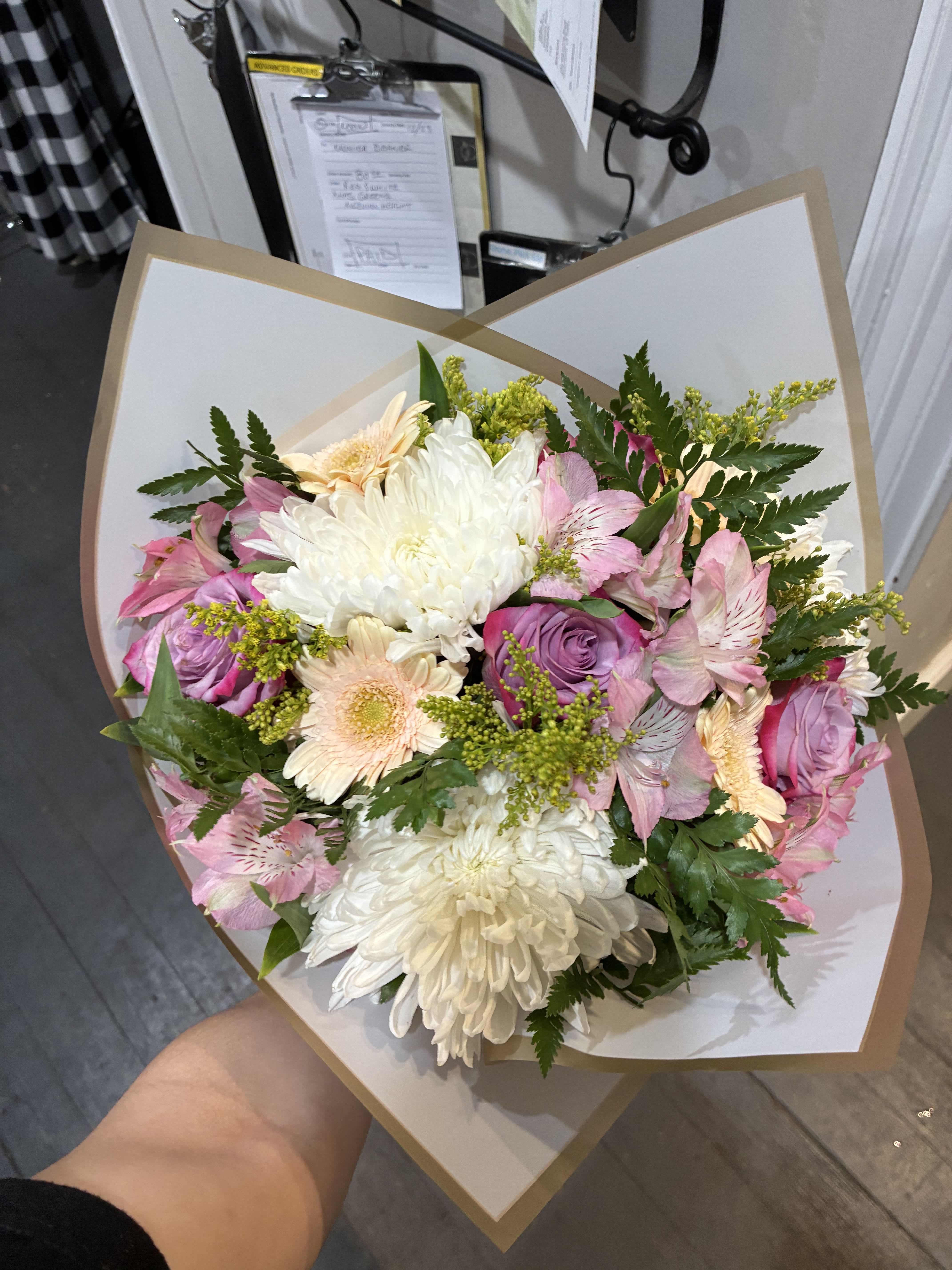 Designer's choice Wrapped Bouquet - *Pictures are to represent size for price, not flower types or colors*   Bouquets are made with the flowers and colors that fit the occasion and what we have in stock.  We typically have Roses, Snapdragon, Solidago, Hydrangea, Alstroemeria, and Sunflowers in stock.