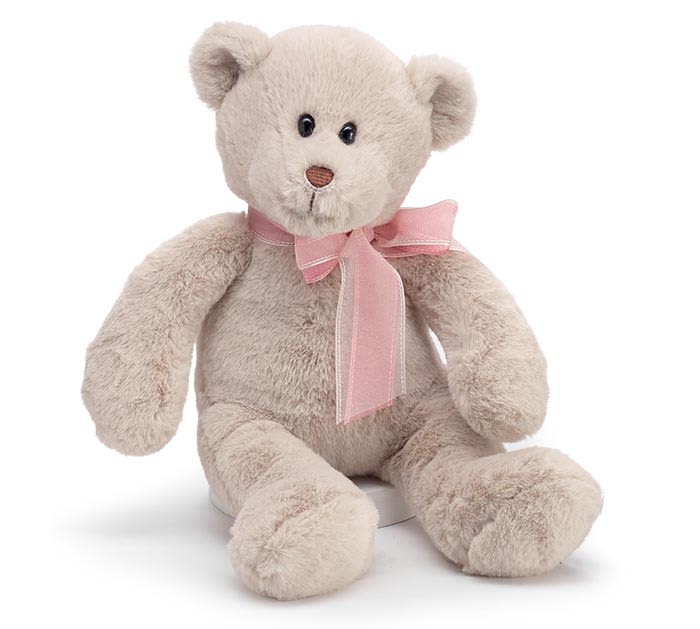 PLUSH SOFT BEIGE BEAR WITH SHEER RIBBON - Beige plush teddy bear featuring a brown embroidered nose and a pink and brown sheer ribbon tied in a bow around the neck. This charming plush bear makes a sweet gift for Valentine’s Day, birthdays, baby showers, or any special occasion. Includes an easy-tie ribbon loop for hanging or display.  Measures approximately 14 inches tall and 10 inches tall in a seated position.