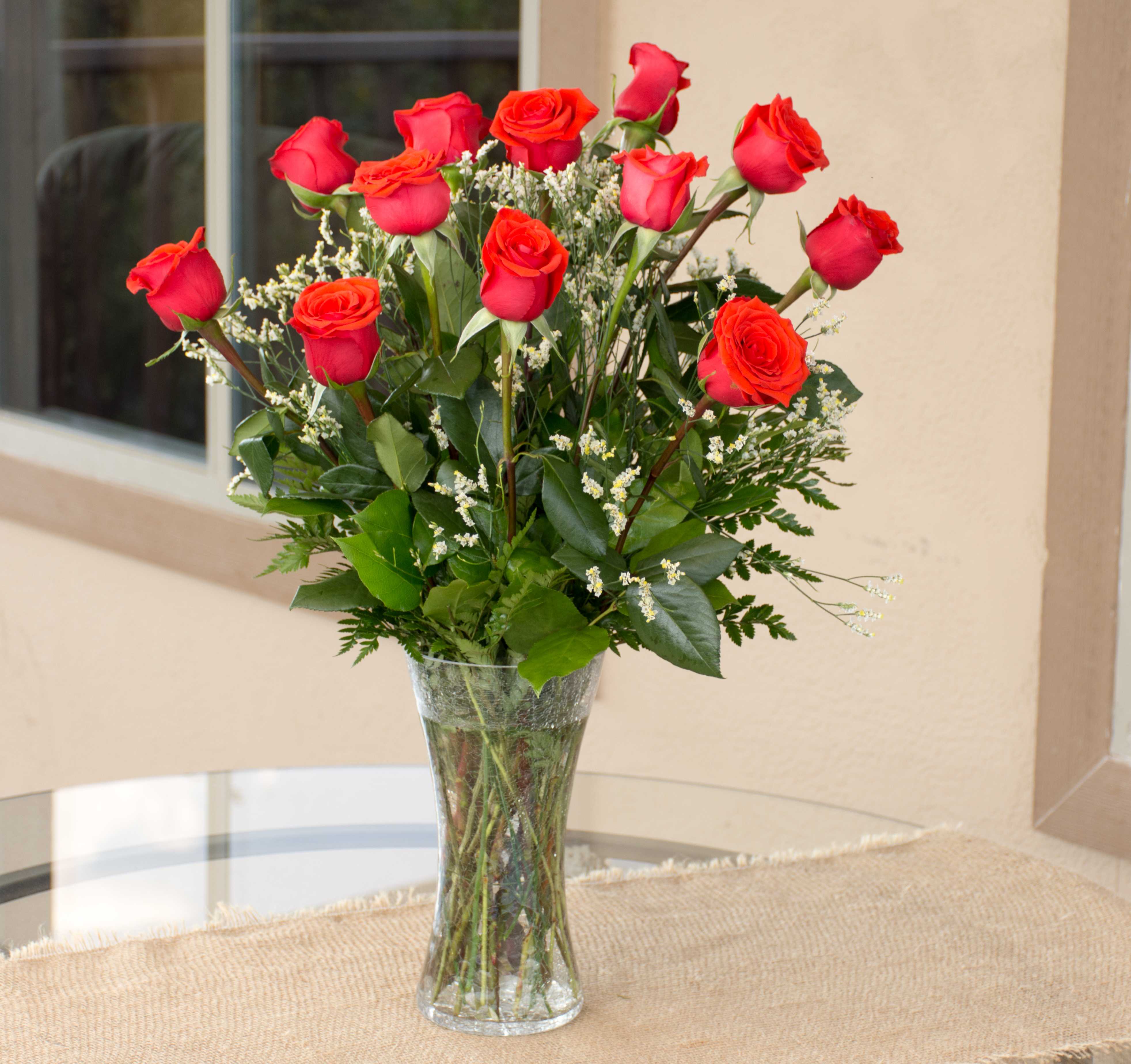 Elegant Roses - A dozen roses with an upgraded filler.  Flower color can be changed by request. 