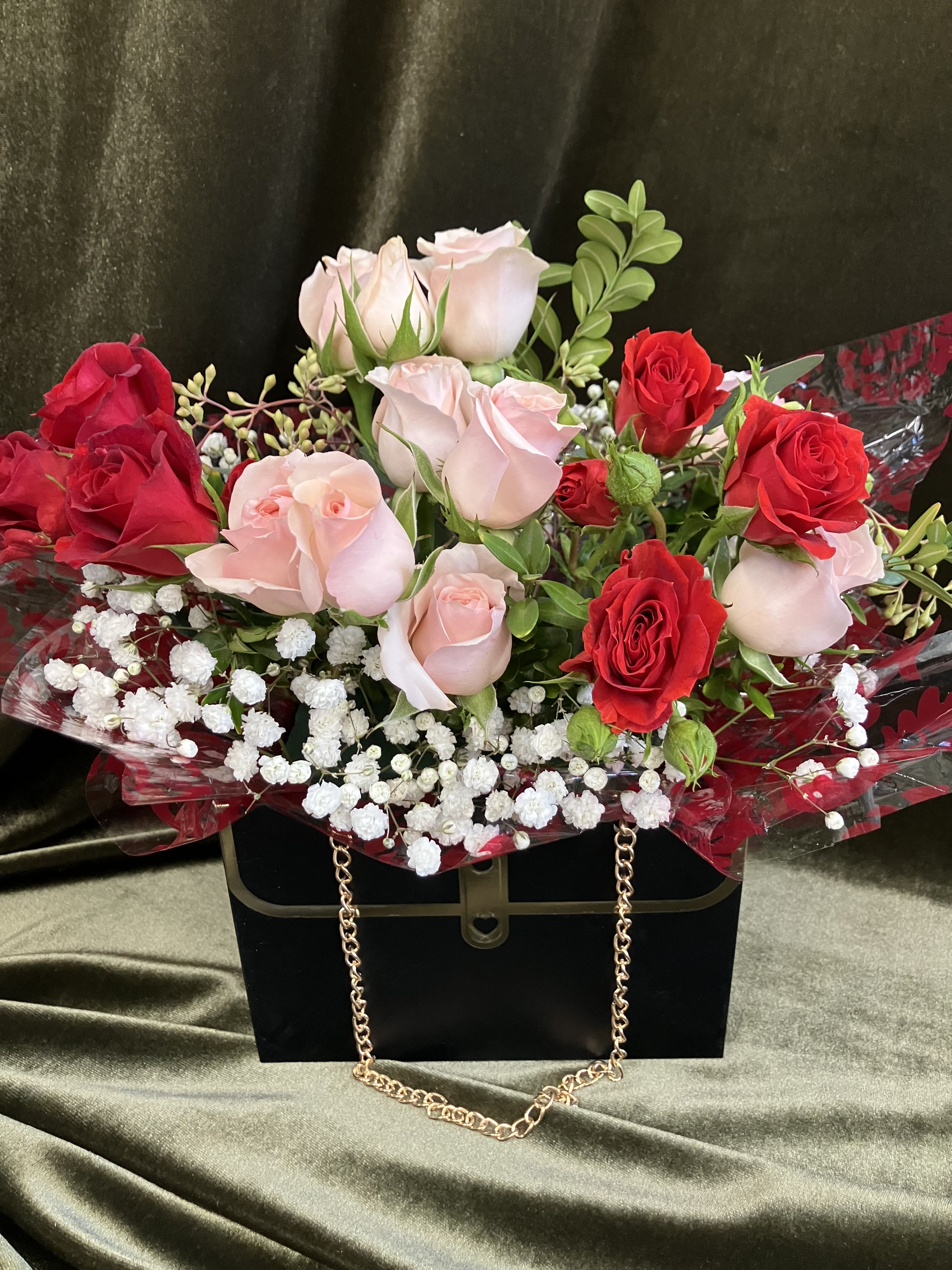Cute Purse Arrangement  - Perfect gift for the girl that loves glam, fashion and bags. A cute little black handbag box with gold chain handles, mini roses, and baby’s breath 