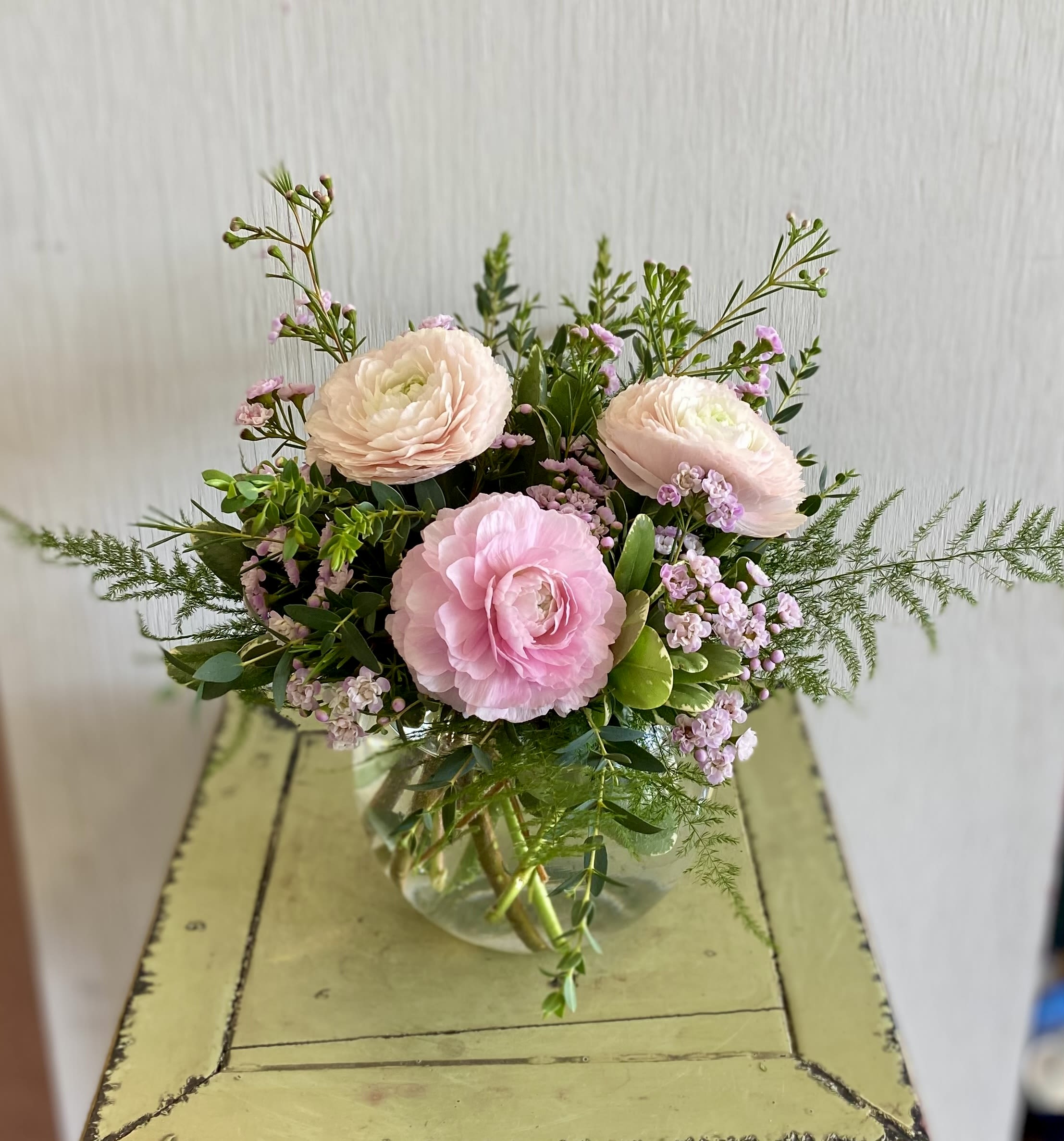 Radiant Ranunculus - Ranunculus are so special! Soft, lush petals. Pretty colors. Arranged in a petite vase with complementary greens and filler.  **NOTE: ranunculus color will vary based on availability