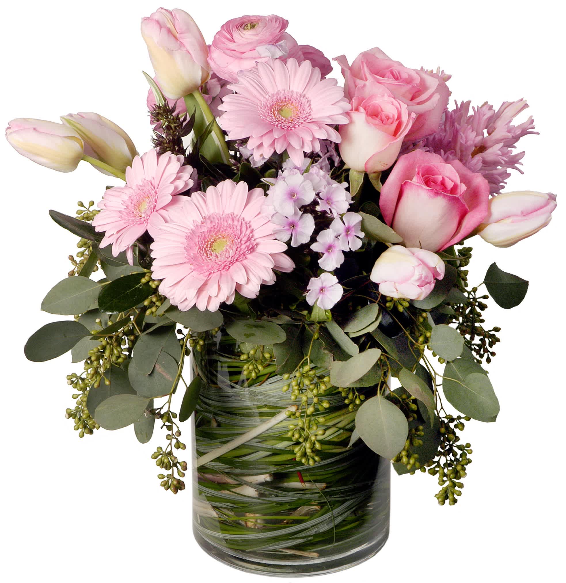 Blushing Blooms  - An enchanting mix of pink tulips, gerbera daisies, ranunculus, and roses, complimented with a mix of greenery for a natural touch of elegance. 