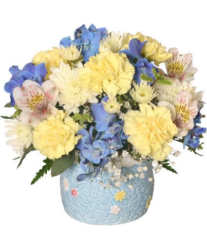 BABY BOY BLOOMS FLORAL ARRANGEMENT - Baby Blue Ceramic Container, Foliage: Seeded Eucalyptus, Oregonia, Leather Leaf, Yellow Carnations, Blue Delphinium, White Cushion Poms, White Alstroemeria, Sprigs Of Babys Breath