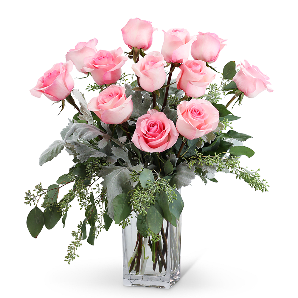 Pink Roses (12)  - Everyone is crazy about our pink roses! Pink roses symbolize femininity, elegance, grace, and sweetness. Send pink roses to celebrate a special occasion, convey gratitude, or to say thank you. This dozen pink rose arrangement, along with the perfect greens, will be sure to make someone's day very special.