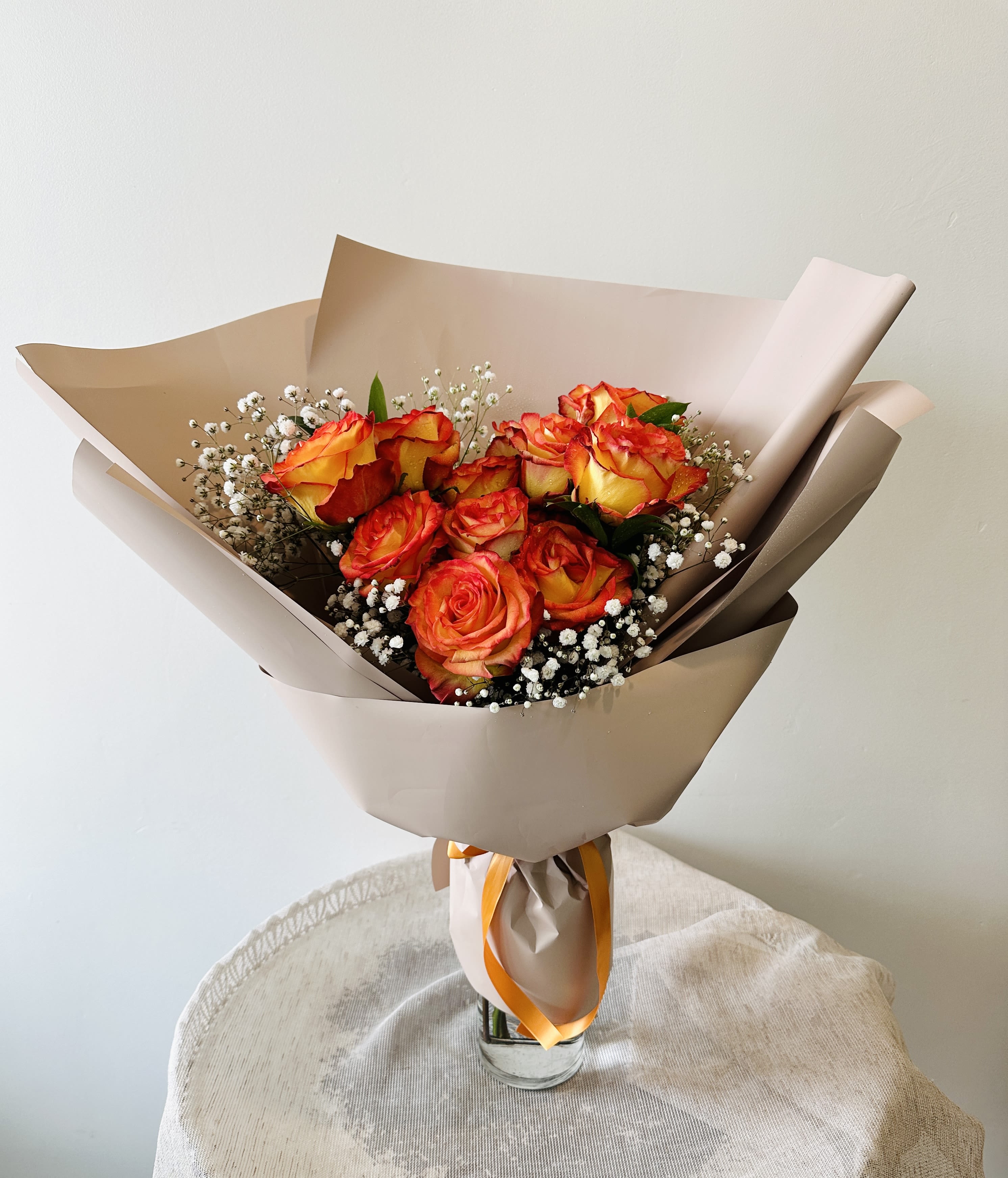 One Dozen Confetti Roses Hand Bouquet (Vase not included) - Add a pop of color to your loved one's day with Flower Talk's playful hand bouquet of a dozen confetti roses, thoughtfully arranged by our skilled florists to create a festive and cheerful vibe.