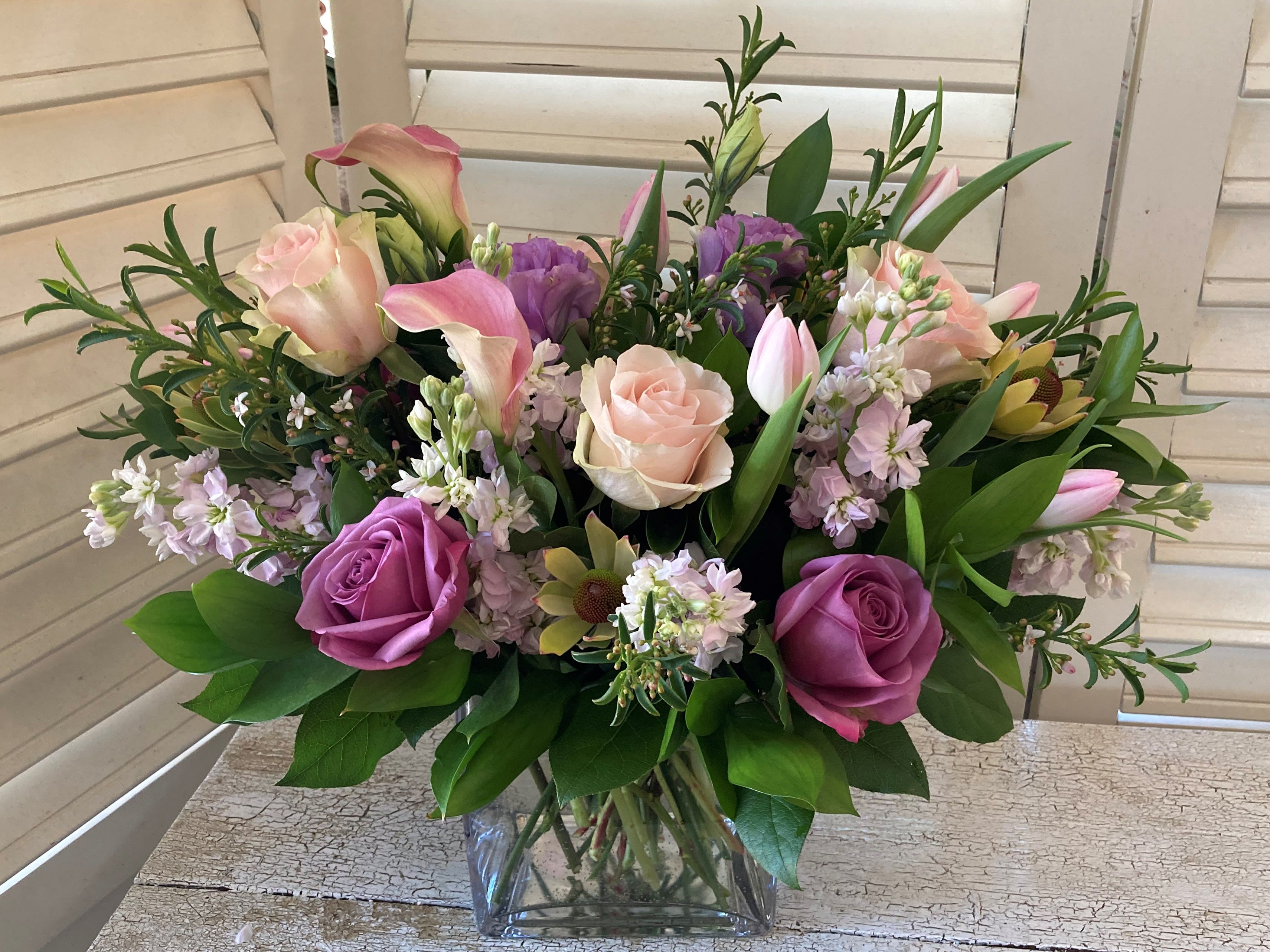 Blush of Spring - Spring blooms in a soft pink and purple palette gracefully arranged in a glass cube or cylinder.  Happy Spring - Happy Everything!