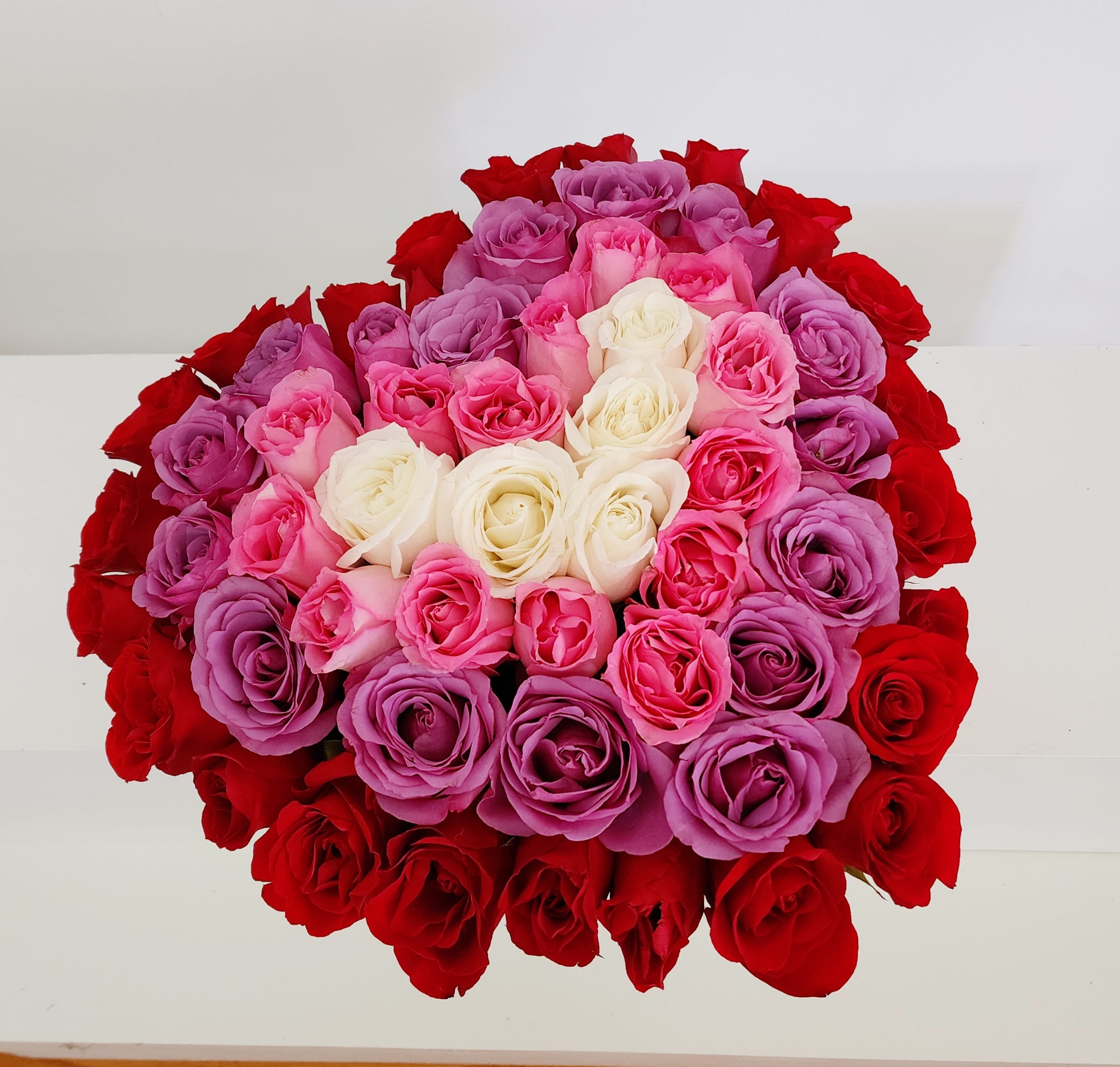 Queen Of My Heart 5 dozen Rose Box - Heart box with almost 60 roses in an ombre style of 24 red, 16-18 lavender, 14 pink, 4 white.  