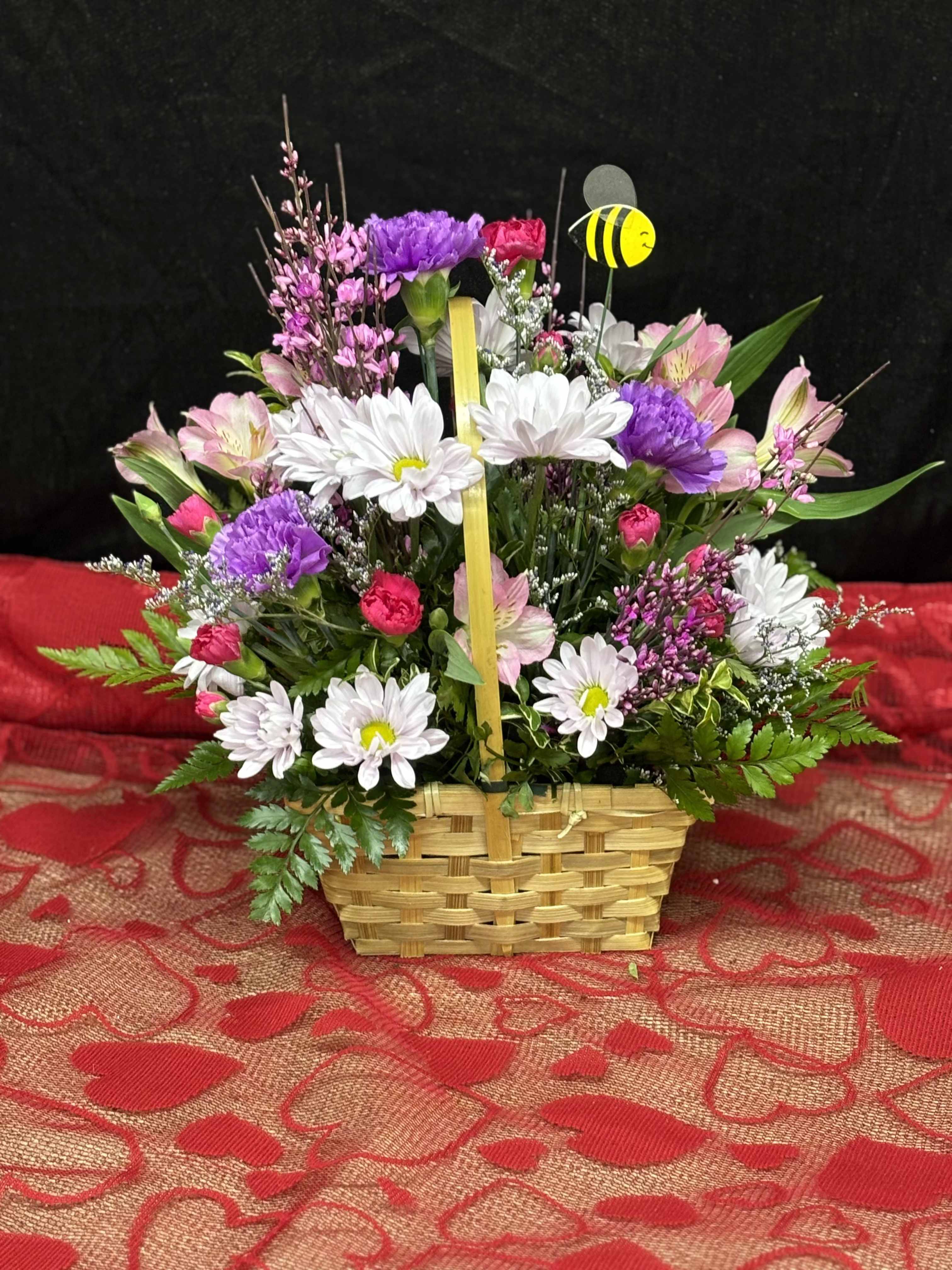 Blooming Basket - Brighten any occasion with our Blooming Basket, expertly arranged with fresh, vibrant blooms. Overflowing with beauty, it;s the perfect way to make a lasting impression.