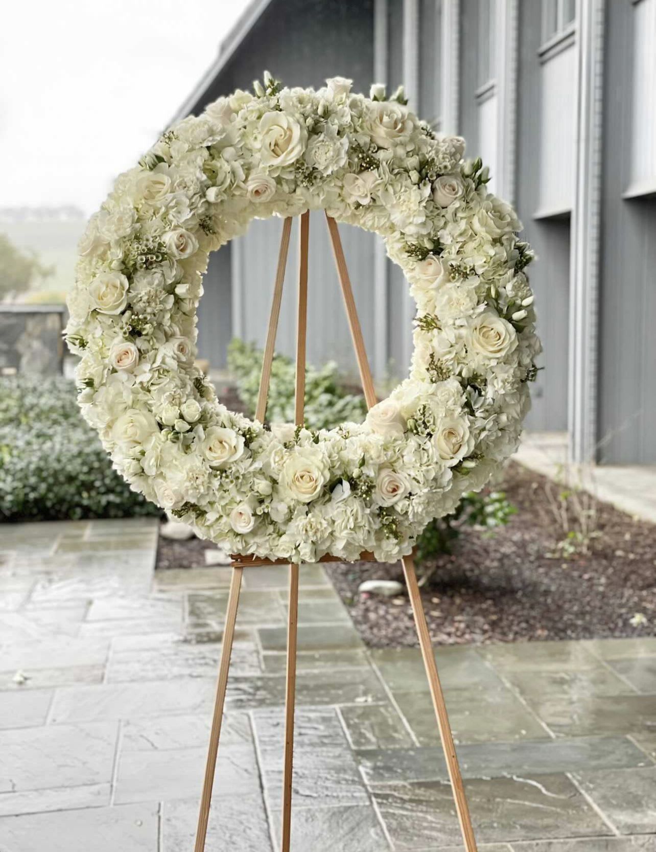 Blanc Sympathy Wreath  - Roses  Hydrangeas  Mini roses  Carnations  Wax flower 
