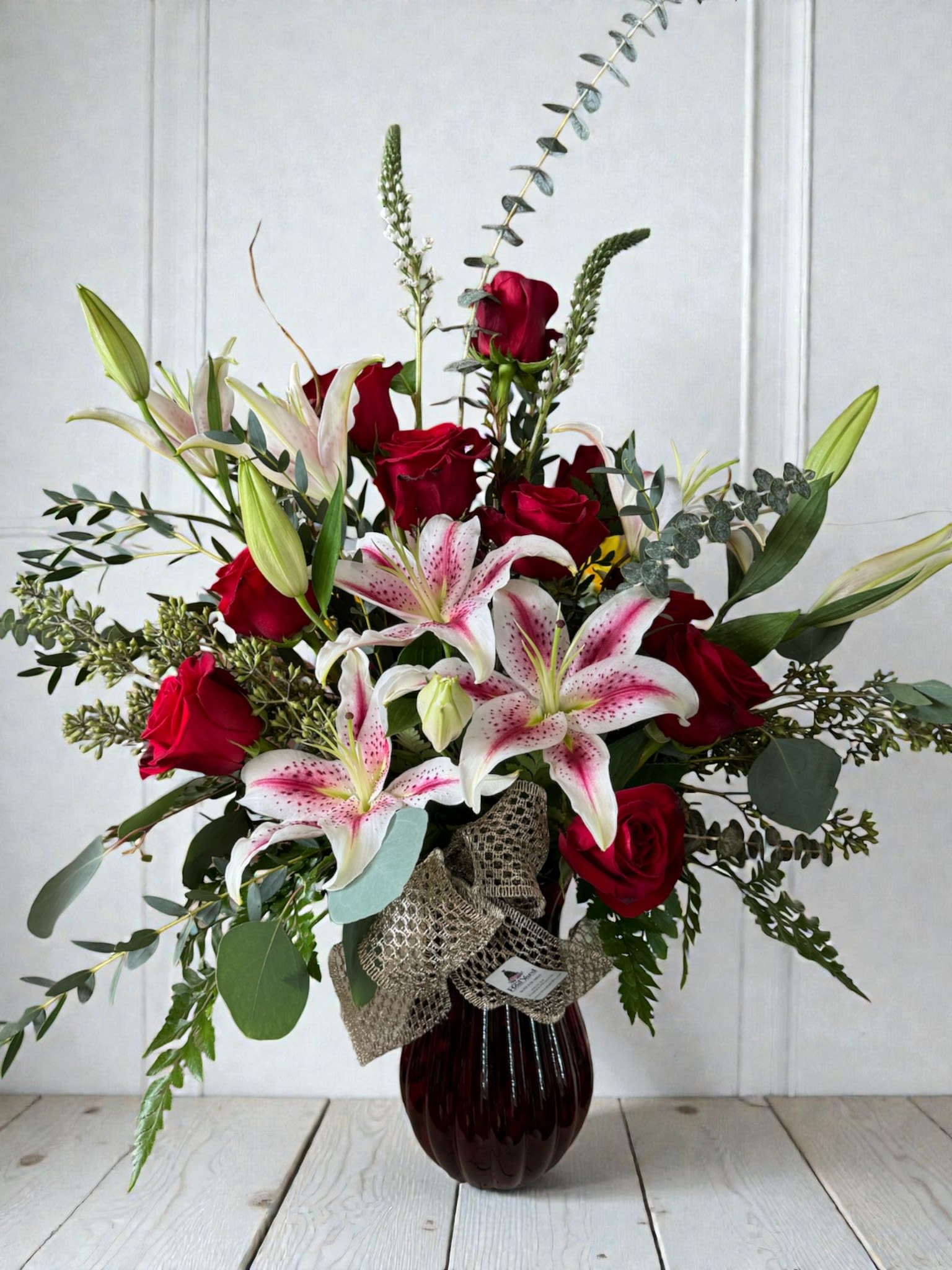 Star Quality - Stargazer lily arrangement with roses. Please specify any changes.