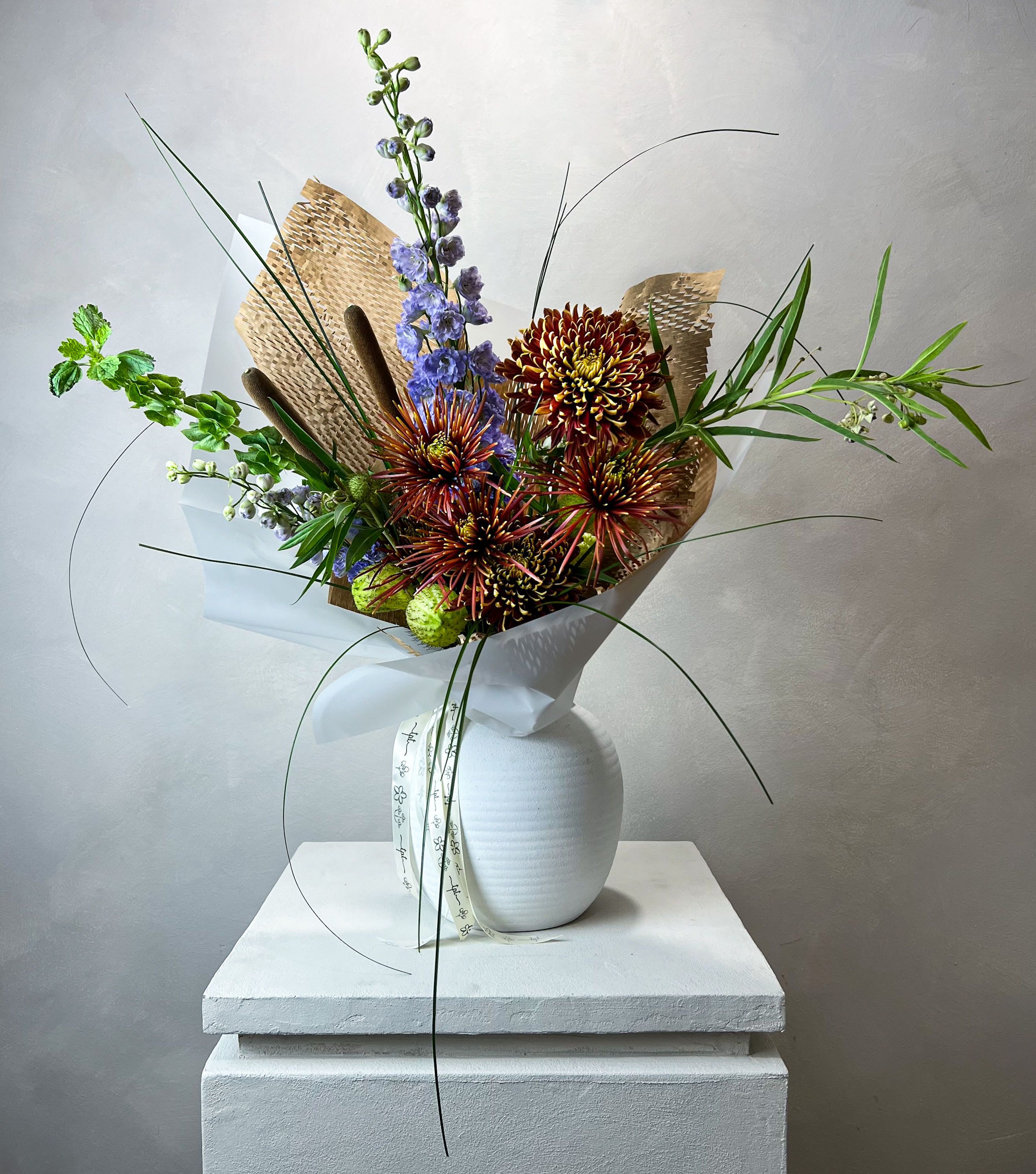 MINI Hwa Bouquet (PICK-UP ONLY) - For unexpected moments or an ordinary day that needs a little lift - MINI Hwa bouquet is a small, budget-friendly bouquet, perfect for those sweet, spontaneous gestures. Features a hand-selected assortment of the freshest seasonal blooms, thoughtfully arranged and elegantly wrapped in Korean-style wrapping for a modern, artistic presentation. Each bouquet is completely unique — colors, textures, and flowers vary with the season and availability, ensuring that no two bouquets are ever the same.  Made as a Petal Designers choice only and Pick-up only, ready when you are.  Every bouquet includes a handwritten note, which comes with care instructions for your blooms.  FINAL SALE POLICY:  All orders are final sale. Due to the custom and perishable nature of our floral designs, we are unable to accommodate cancellations, refunds, or exchanges once an order has been placed. Each arrangement is made uniquely for you, with care and attention to detail.  Images are for inspiration only - we do not replicate past designs or recreate another florist’s work. Each bouquet is handcrafted with creativity, intention, and care.