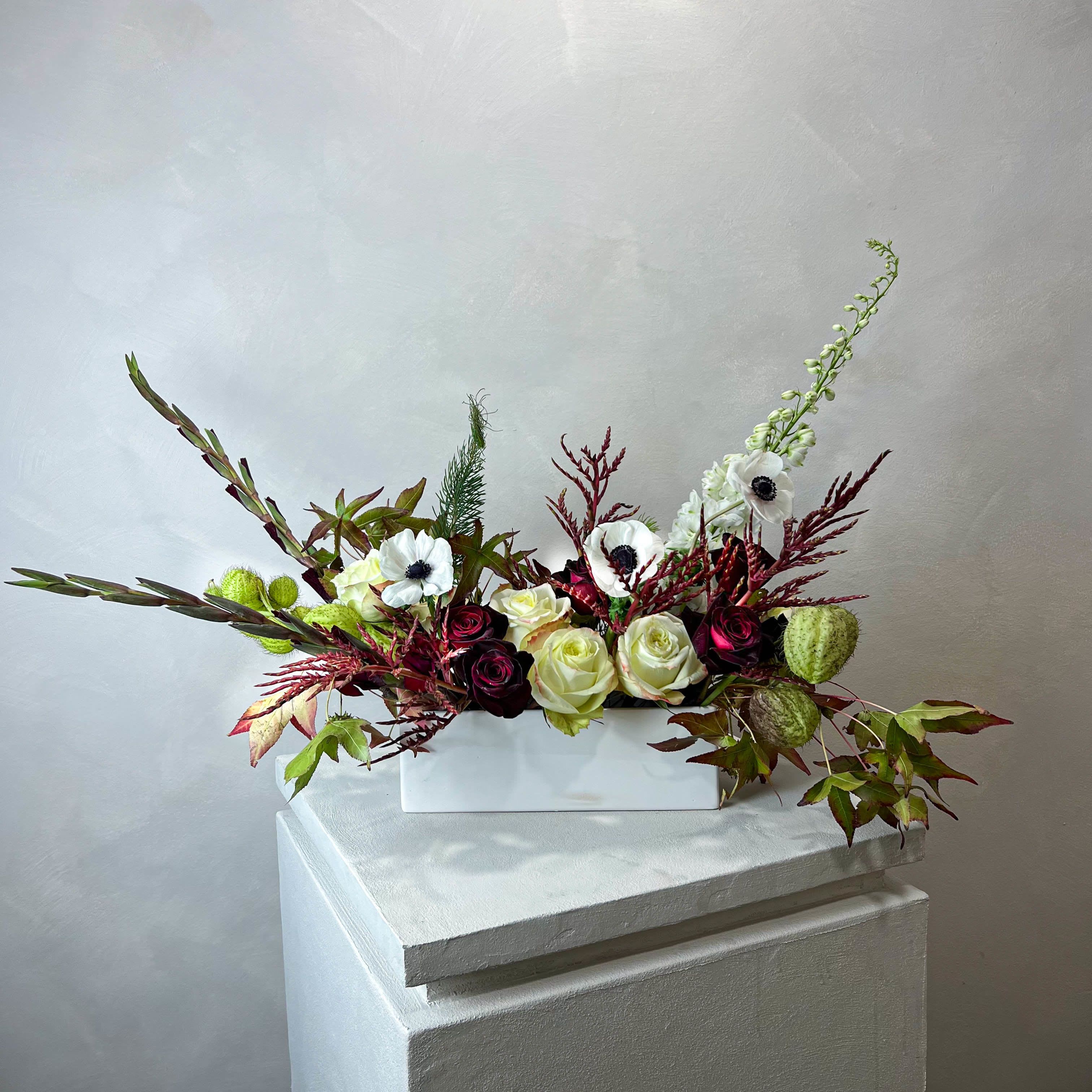 Songeun Petal Designer’s Choice Arrangement - Our Petal Designer’s Choice is a thoughtfully curated selection of the freshest seasonal blooms, arranged to reflect the beauty of the moment.  Each design is completely unique - colors, textures, and flowers vary with the season and availability, ensuring that no two arrangements are ever the same. Every piece is artfully created in a water-filled CERAMIC VASE for a polished, lasting presentation.  You may also choose to include a handwritten note, which comes with care instructions for your arrangement.  PLEASE NOTE: Delivery orders should be placed 2–3 days in advance. For same-day delivery, please call or text us at 704.975.2774 to check availability.  FINAL SALE POLICY: All orders are final sale. Due to the custom and perishable nature of our floral designs, we are unable to accommodate cancellations, refunds, or exchanges once an order has been placed. Each arrangement is made uniquely for you, with care and attention to detail.  Images are for inspiration only - we do not replicate past designs or recreate another florist’s work. Each bouquet is handcrafted with creativity, intention, and care.