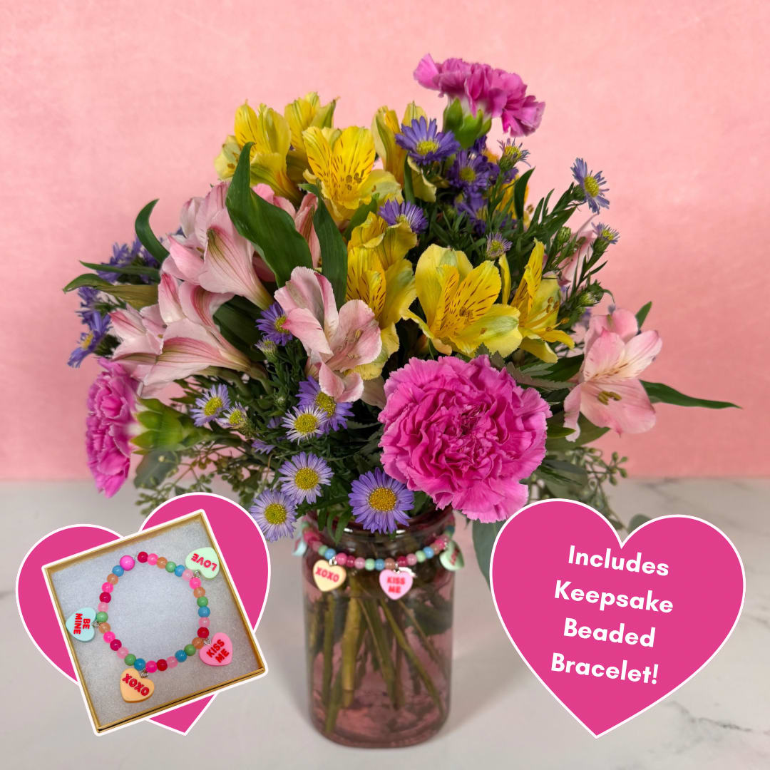 Sweet Talk Bouquet &amp; Bracelet Bundle - Our Sweet Talk Bundle is a gift that'll make you the talk of the town! Featuring bright, colorful blooms including lavender carnations, yellow and pink alstroemeria, and lavender monte casino, this bouquet is held in a lovely pink glass vase, and includes a conversation heart collectible charm bracelet from Sunshine Orchard Designs, allowing this gift to be worn and treasured forever. Why choose between flowers and jewelry when you can get both? Get this bundle today and win Valentine's Day with a single purchase!  NOTE: Bracelet beads are subject to availability, and may appear slightly different than those pictured. Color scheme and relative sizes will be kept as true to the image as possible.