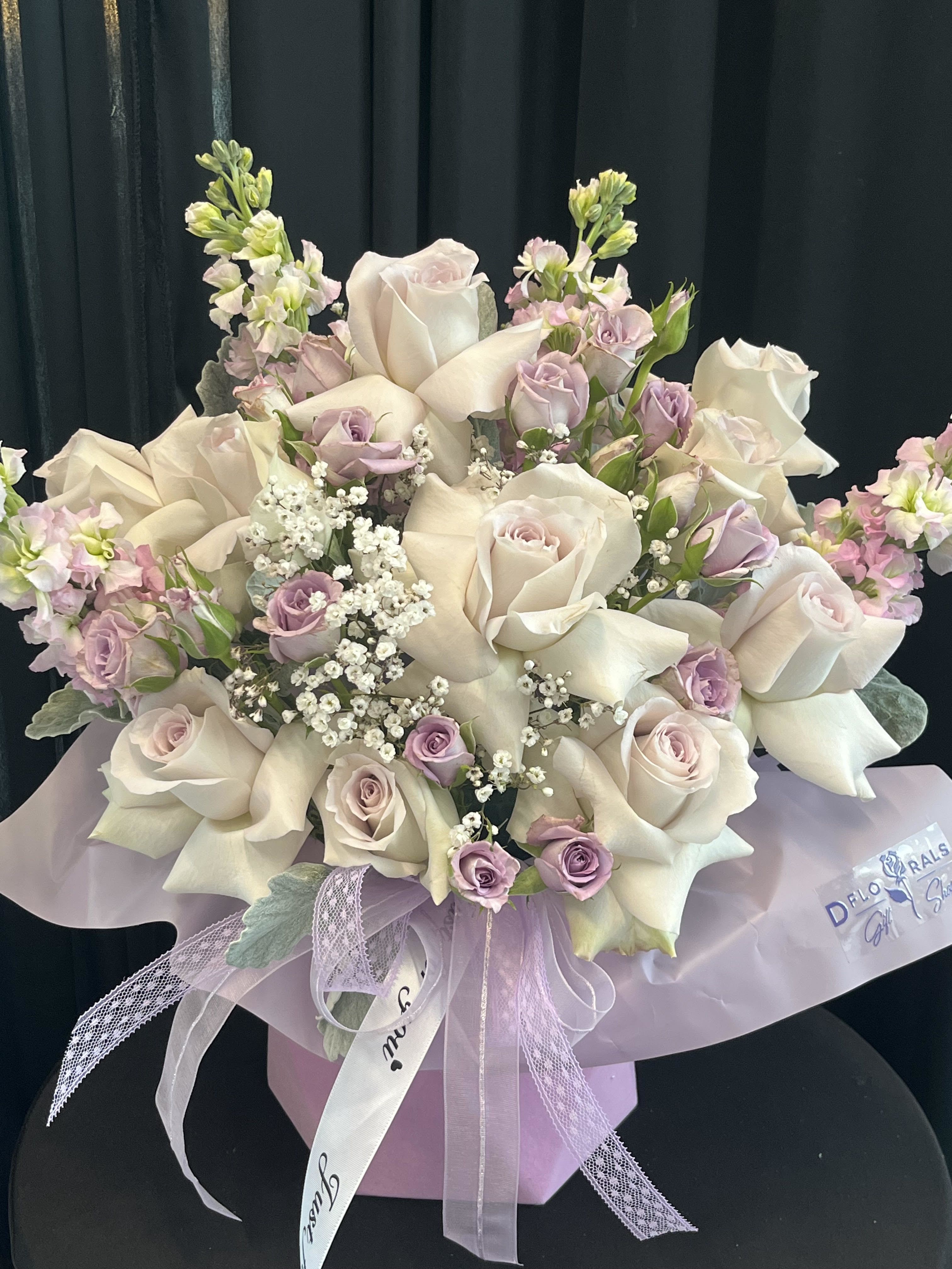 Royal Box - We are dedicated to delivering your emotional sentiments with the utmost care, ensuring that each arrangement is fresh, beautiful, and arrives on time. Due to the natural variability of flowers, as well as seasonal and regional availability, substitutions may occasionally be necessary. Rest assured, any substitutions will be of equal or greater value, and we will make every effort to preserve the overall design, including the shape, size, style, and color combinations of the arrangement. In the case of single-variety arrangements, the specific variety will take precedence over color to maintain the intended look and feel. Thank you in advance for understanding that flowers are a natural product and may vary slightly in appearance.  Substitution Policy In some instances, our photo may represent an overall theme or look and include a one-of-a-kind vase which cannot be exactly replicated.  Although the actual bouquet may not precisely match the photo, its temperament will. Occasionally, substitutions of flowers and/or containers happen due to weather, seasonality and market conditions which may affect availability. If this is the case with the gift you’ve selected, we will ensure that the style, theme and color scheme of your arrangement is preserved and will only substitute items of equal value or higher value.  If any design elements are of major importance to your order, please include them in the florist instructions at checkout or contact us to ensure availability.