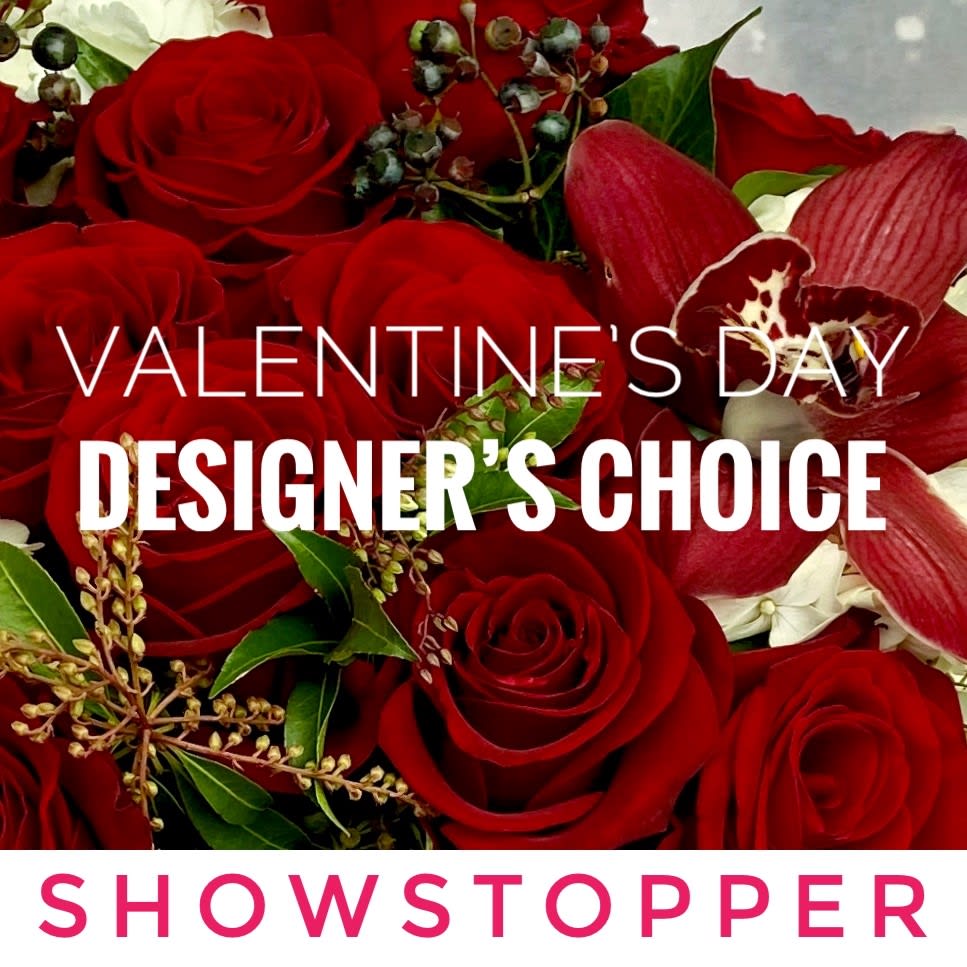 Showstopping Valentine's Day Arrangement - Not sure what to send your sweetheart, but you know it has to be over-the-top gorgeous? Let our designers go wild to create a Valentine's Day arrangement for you that is a Showstopper. They will select a beautiful vase and the best of our premium flowers to create stunner that is unlike anything your Valentine has ever seen. Send a Showstopper and your sweet will never doubt that they are loved!   You are welcome to give us suggestions under Special Instructions when you place your order. If you have specific requests, we would love for you to call us to place your order so that we can discuss them when you and ensure our ability to accommodate them. We will make every effort to fill your order as requested and will make appropriate substitutions if we are not able to find your first choice.  The size will vary but the arrangement will be large and unforgettable!