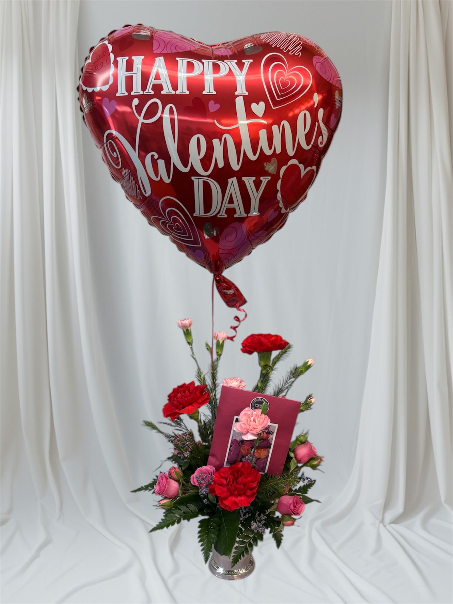 Cupid's Crush - Cupids favorite flowers in his favorite colors, includes fragrance sachet &amp; a Mylar balloon. Trust Cupid!  (All designs are arranged as similar as possible. We promise to keep the same color, style, and overall theme with what Mother Nature generously blesses us with.)