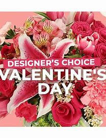 Designers' choice Valentine's Day arrangement - Fresh flowers arranged in a vase with mixed seasonal flowers in reds, purples, lavenders, pinks, and whites.