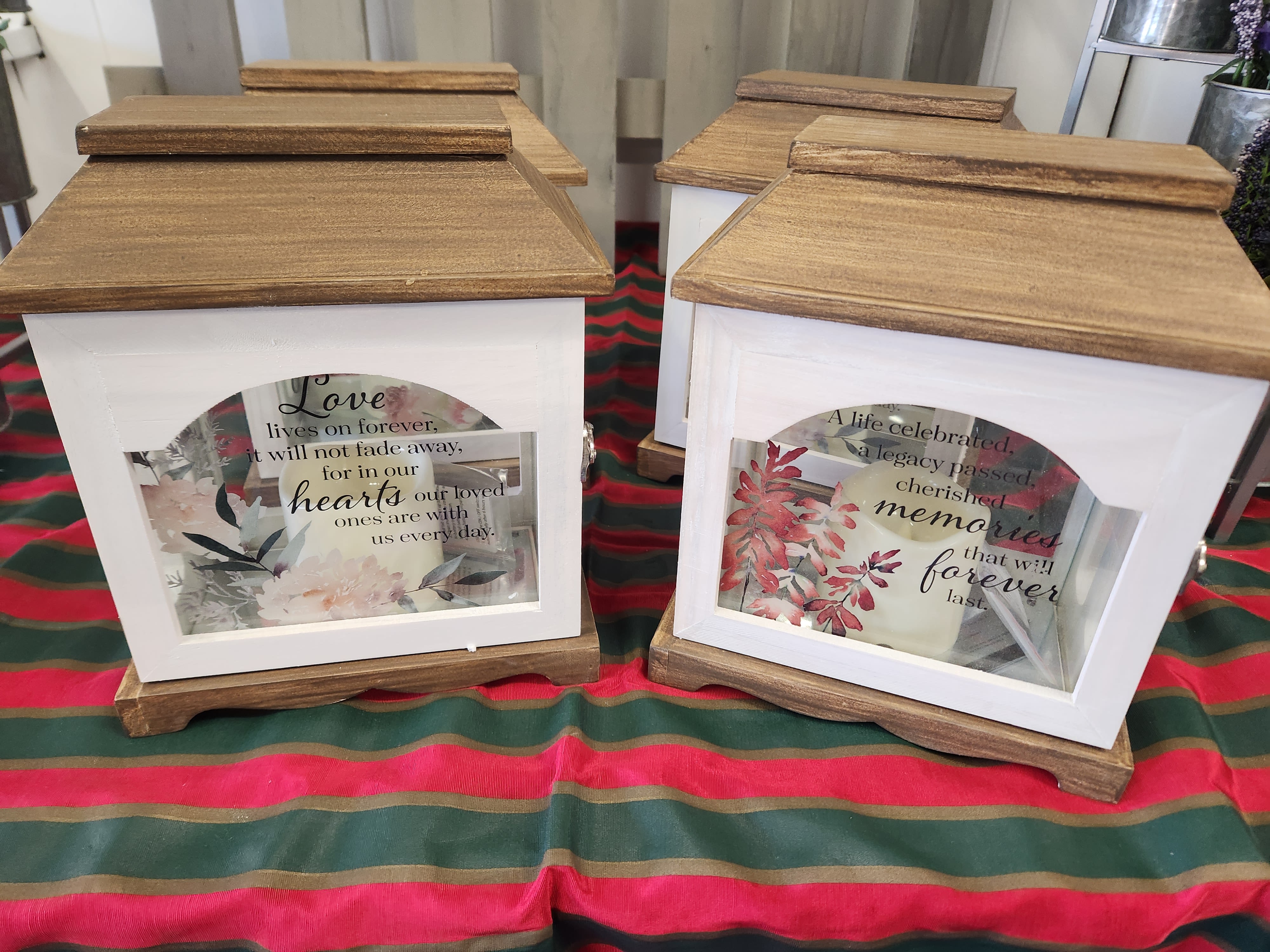 Medium Lantern - Medum size lantern with led candle and a bow Deluxe pricing includes silk flowers added  choices are: 1 Love lives on forever, it will not fade away, for in our hearts our loved ones are with u every day. 2 A life celebrated, a legacy passed, cherished memories that will forever last. 3 If there ever comes a day when we can't be together, keep m your heart and I'll stay there forever