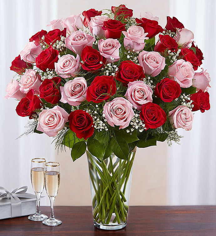 48 Pink and Red Rose mix - Our radiant long stem roses are the ultimate romantic surprise. FOUR, dozen blooms in charming pink &amp; classic red are artistically arranged by our expert florists inside an elegant glass vase and personally hand-delivered to help you express how you feel in a beautiful way.  All-around arrangement with 48 long stem pink &amp; red roses; accented with baby’s breath and assorted greenery We select the freshest flowers available, so shade of rose may vary due to local availability Artistically arranged in a classic clear glass vase