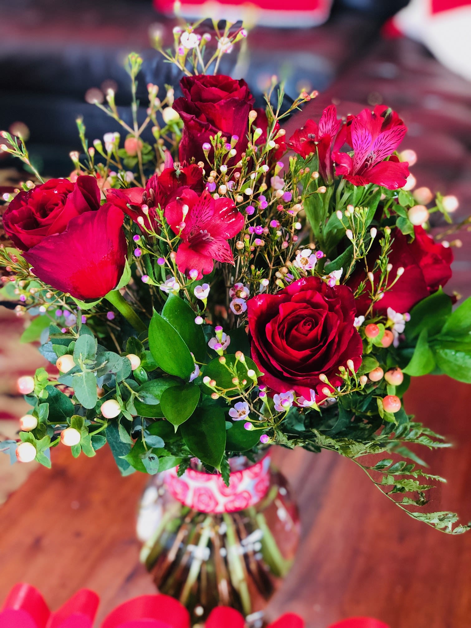 Pouncing on you - Half a dozen roses (Red panthers) with seasonal flowers.