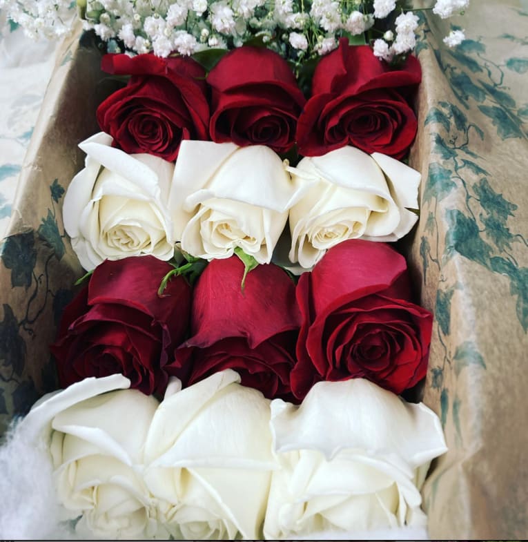 12 Long Stem White and Red roses In a box - 12 Long Stem White and Red roses In a box with greens and filler. Upgrades provide additional stems in increments of 12.