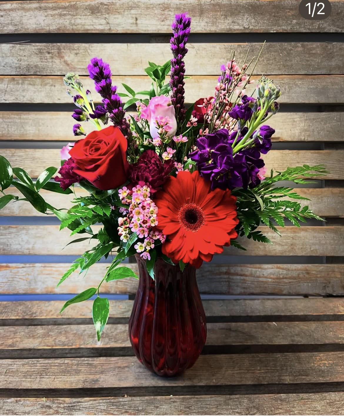 Valentine’s Day Designer’s choice red Jordan vase  - Designers choice of Valentine’s Day themed flowers, arranged in a red Jordan vase. 