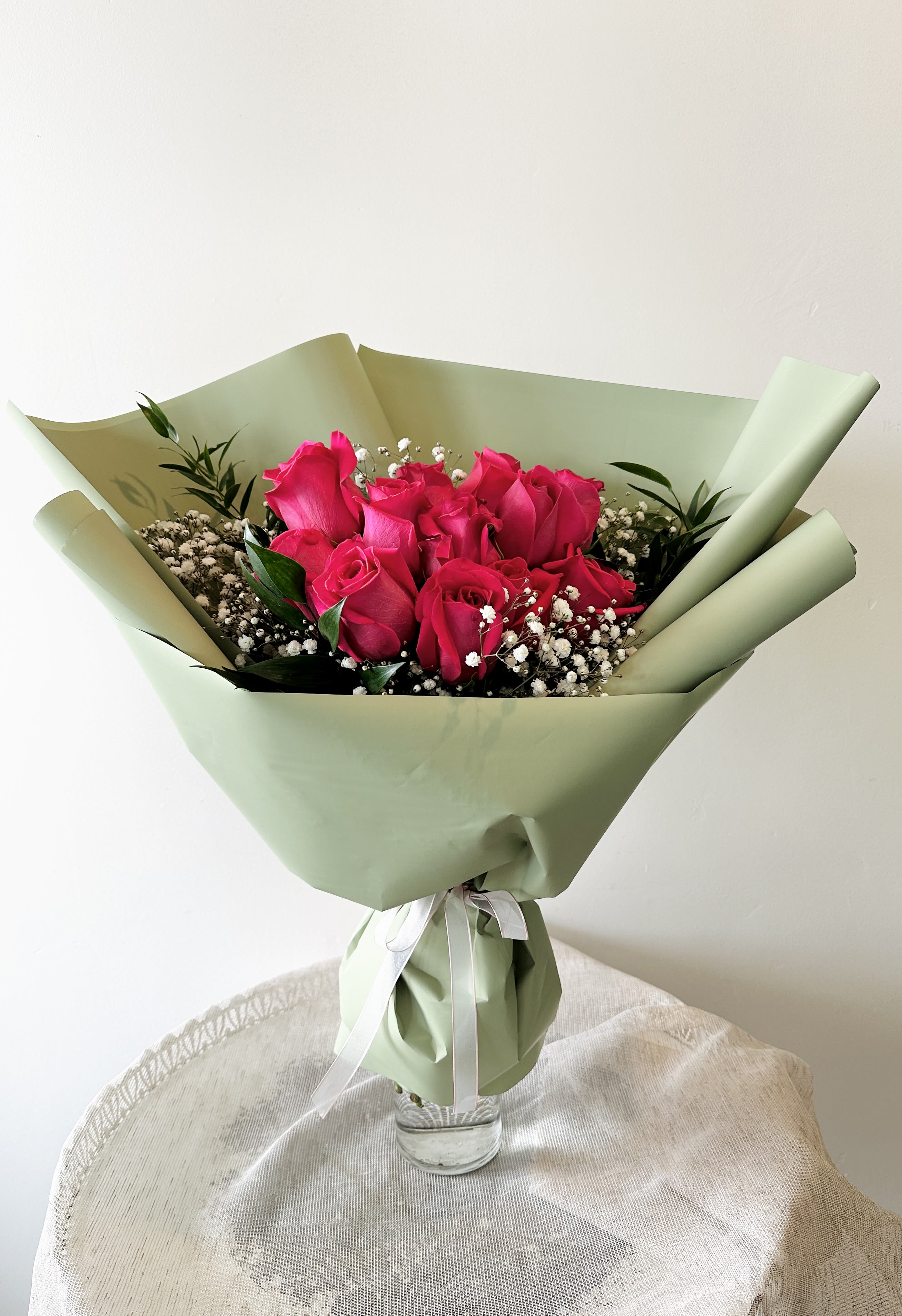 One Dozen Hot Pink Roses Hand Bouquet (Vase not included) - 12 hot pink roses in a hand bouquet