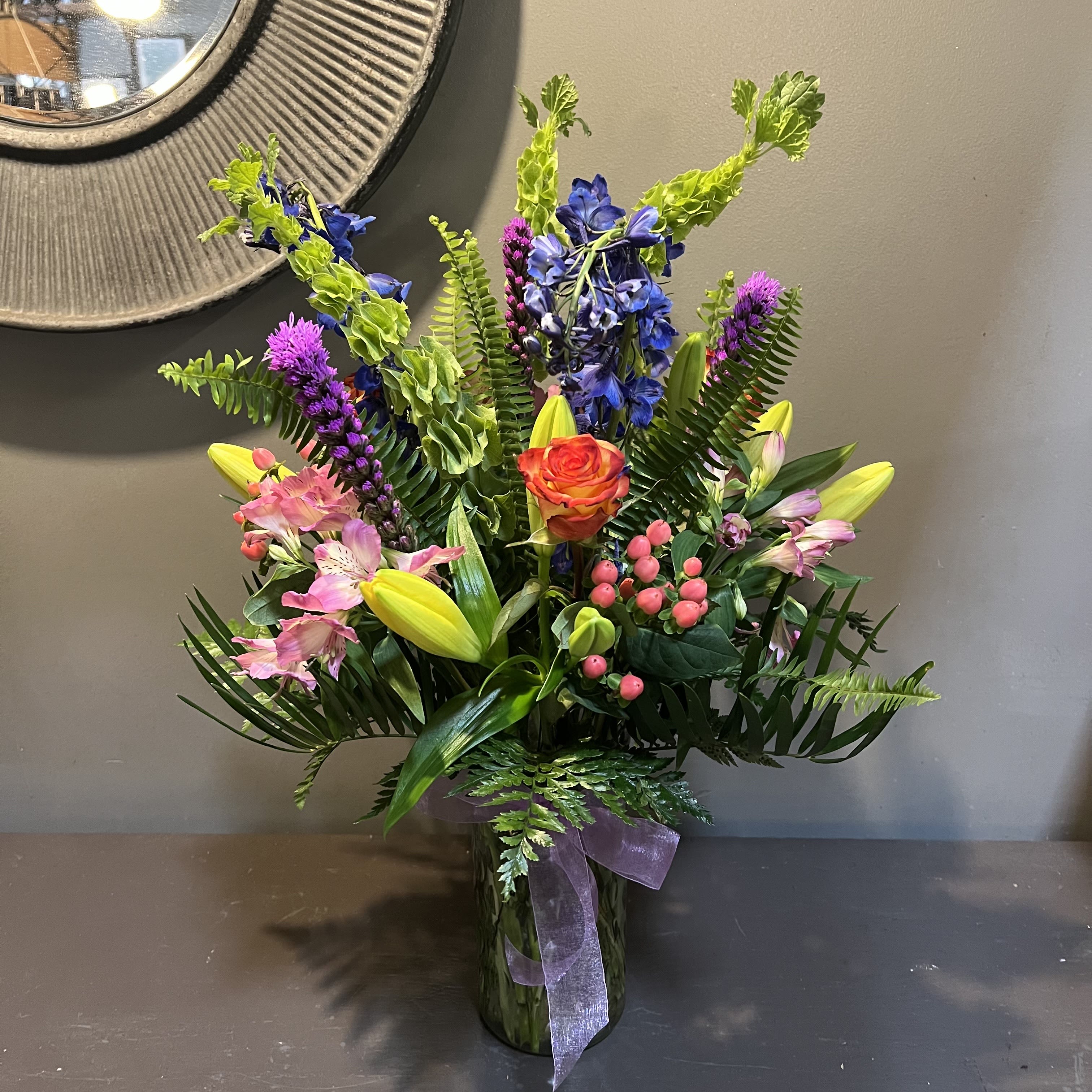 Spring Serenity - A sweet colorful bouquet to brighten everyone's day!  Arrangement measures 27" tall and 18" wide and arrives in a glass vase.