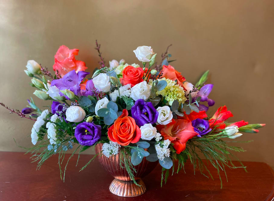 Glory - Arrangement with white and orange roses, lisianthus, gladiolus, statice, white spray roses and greens. 