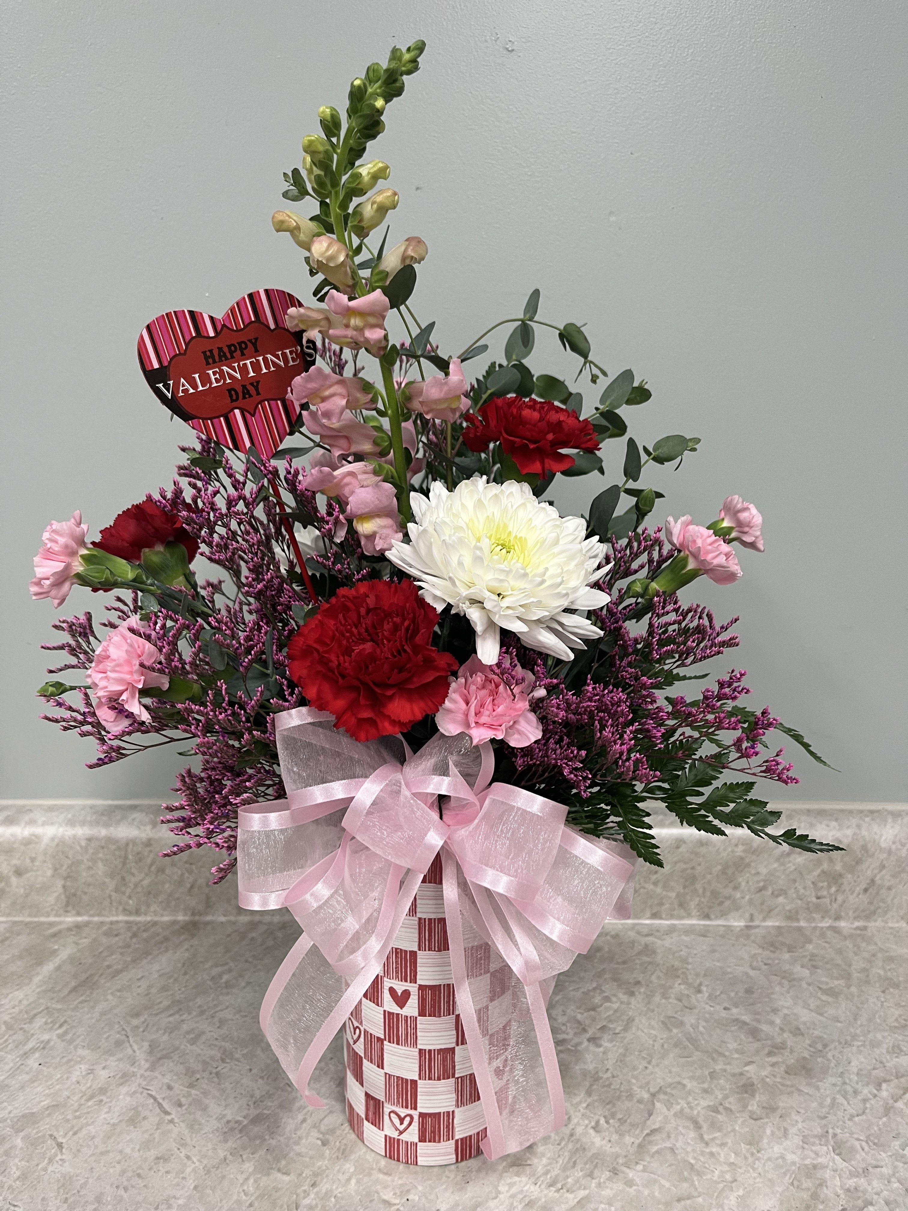 Checkered Sweetheart Bouquet - Checkerboard ceramic vase with assorted red, white  and pink fresh flowers approximately 21" tall  all around arrangement
