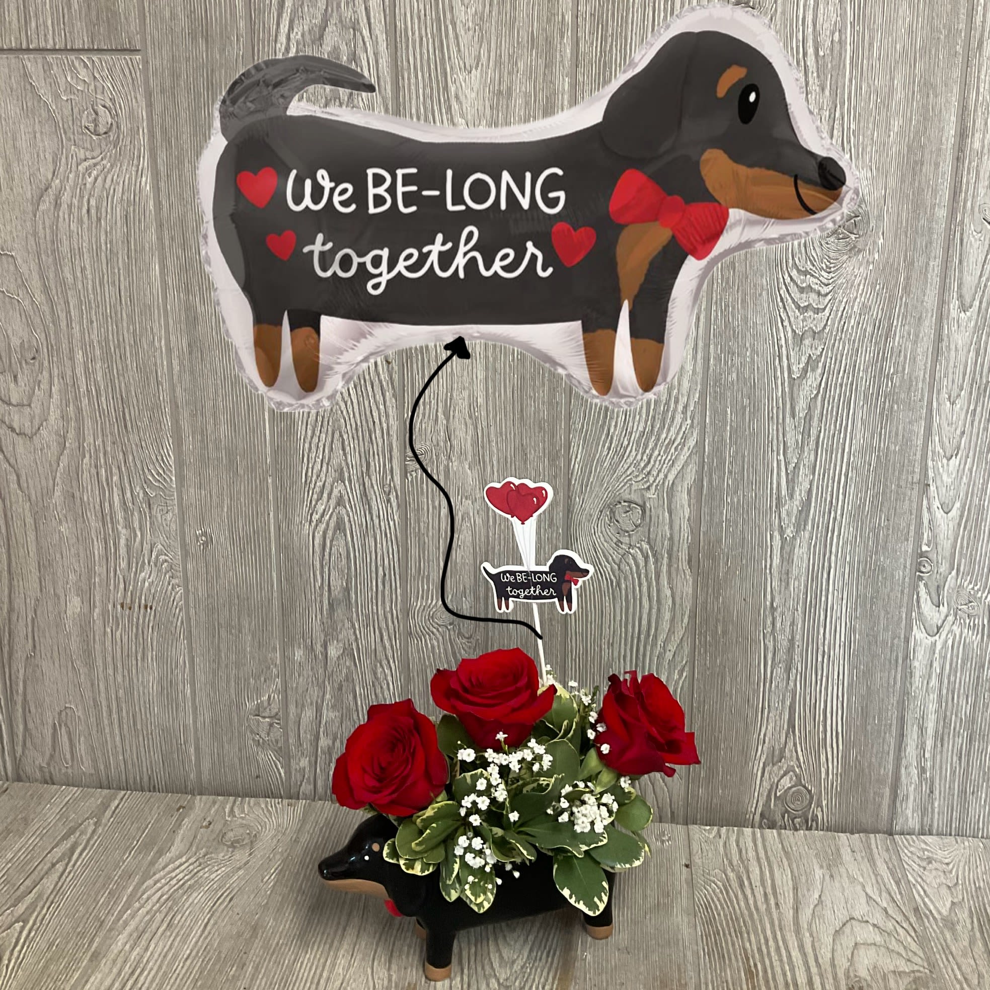 Paws and Kisses  - Put a smile on your sweetheart's face with this witty, romantic dachshund themed gift set. Featuring a rose arrangement in a keepsake ceramic vase, paired with a matching 28" helium-filled mylar balloon and/or an embroidered plush dog. Arrangement comes with an on-theme decorative pick. Colors and flowers may vary. 