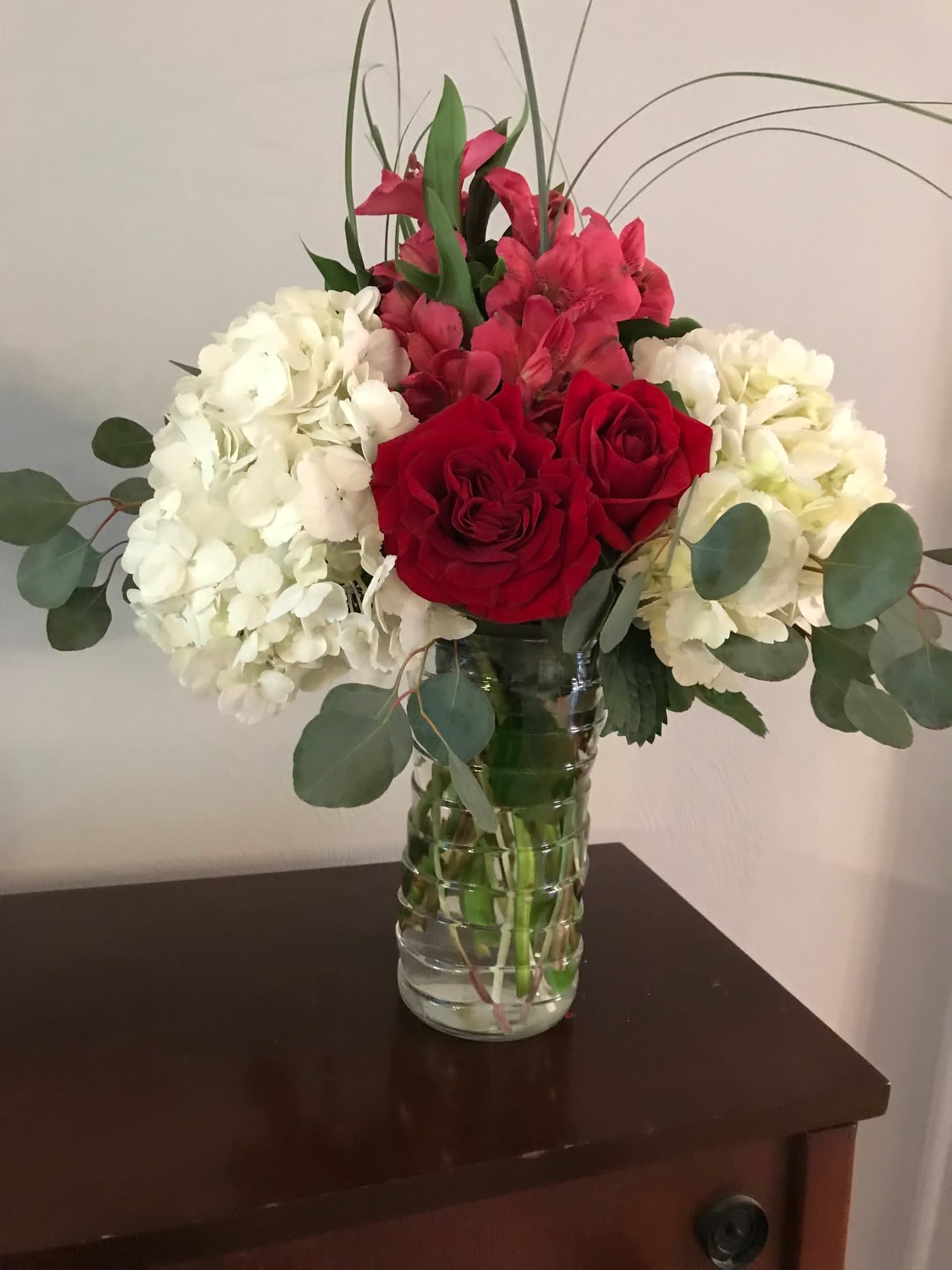 Red and white for Valentines - White hydrangea with red roses being accented