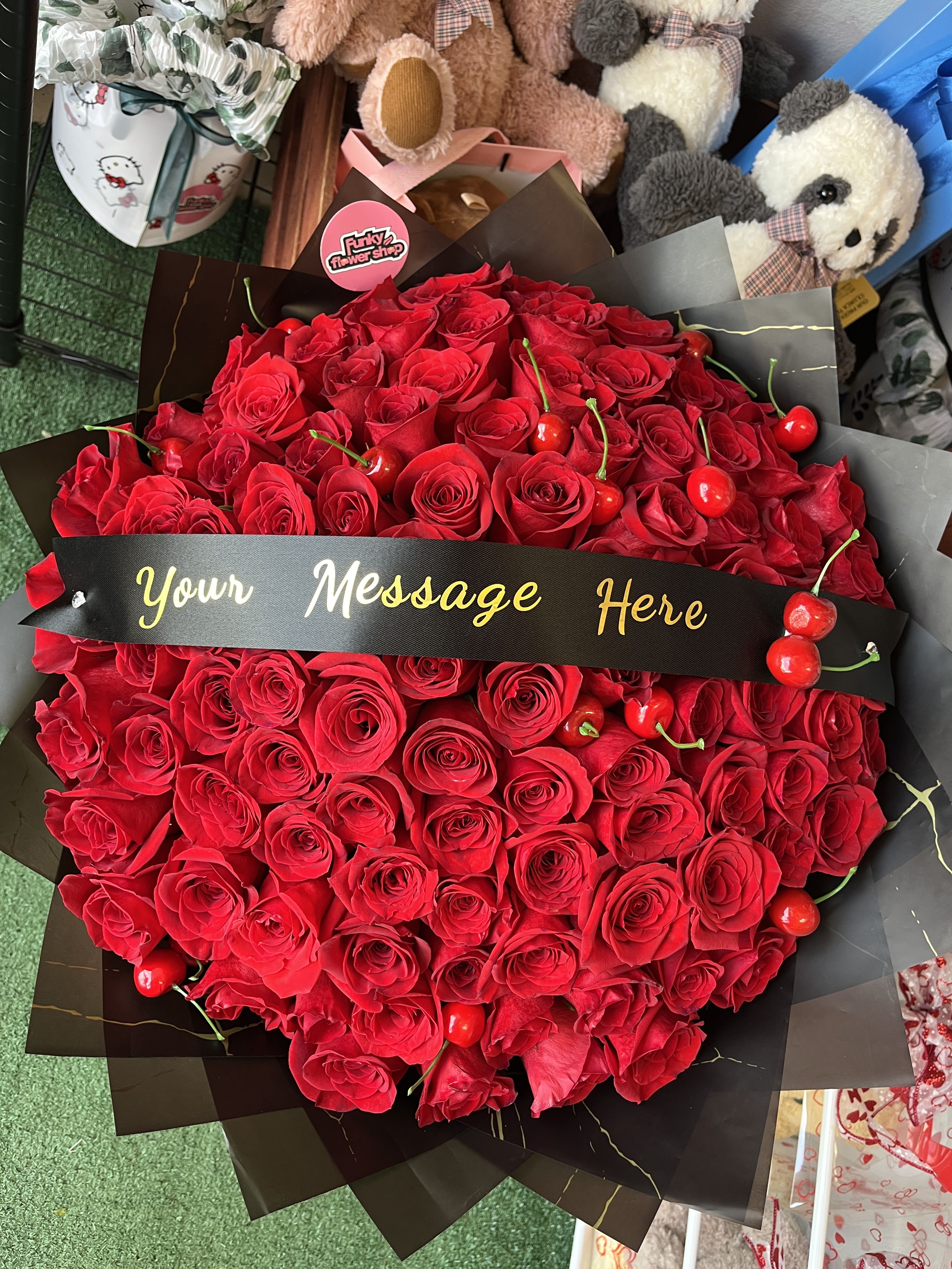 Cherry supreme - Averages 100 roses with cherries and a customizable sash