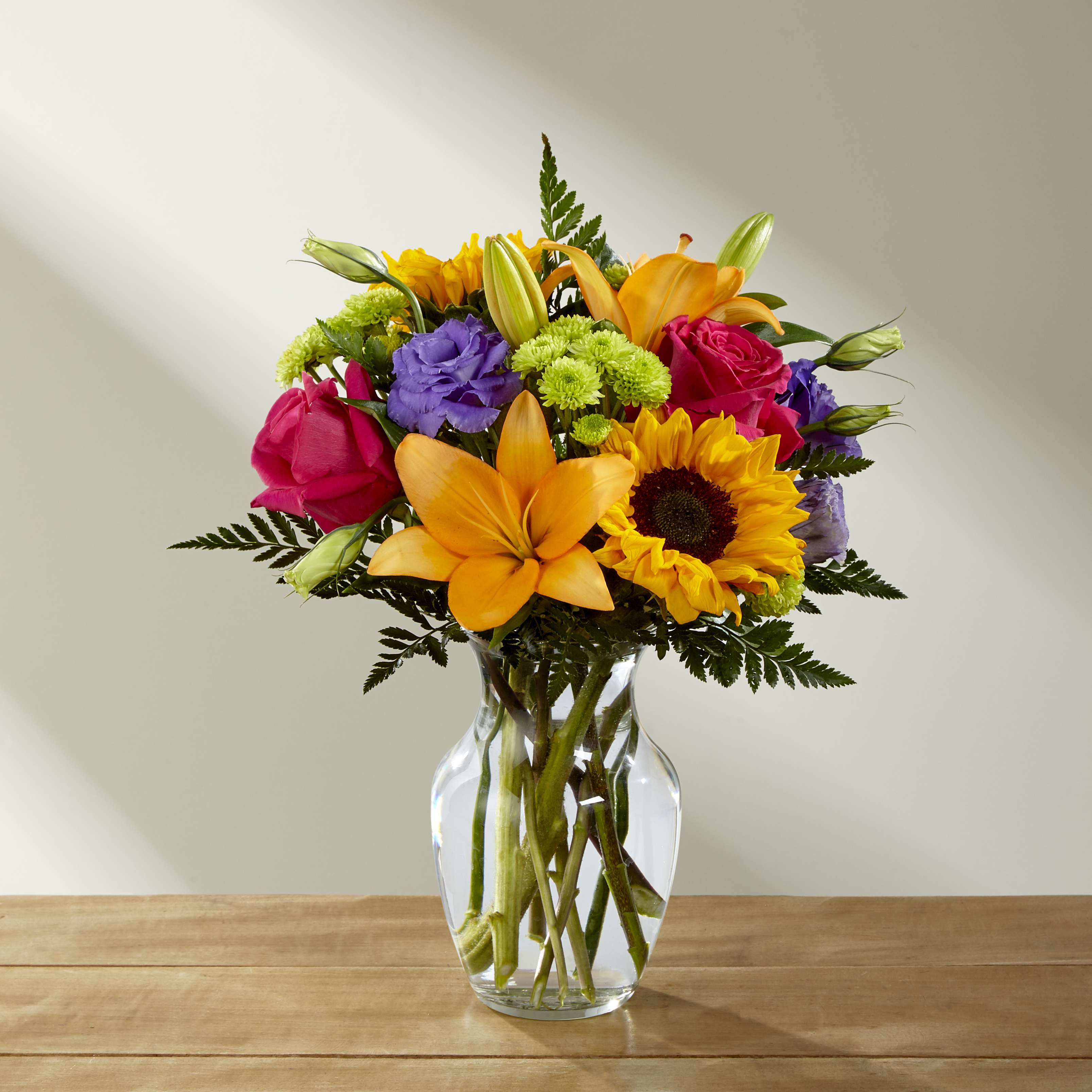 Best Day - Make this day their best day. Our local florist handcraft a colorful array of flowers in a clear glass vase to create a celebration in bloom. Perfect to give for a special reason or to simply share a smile.
