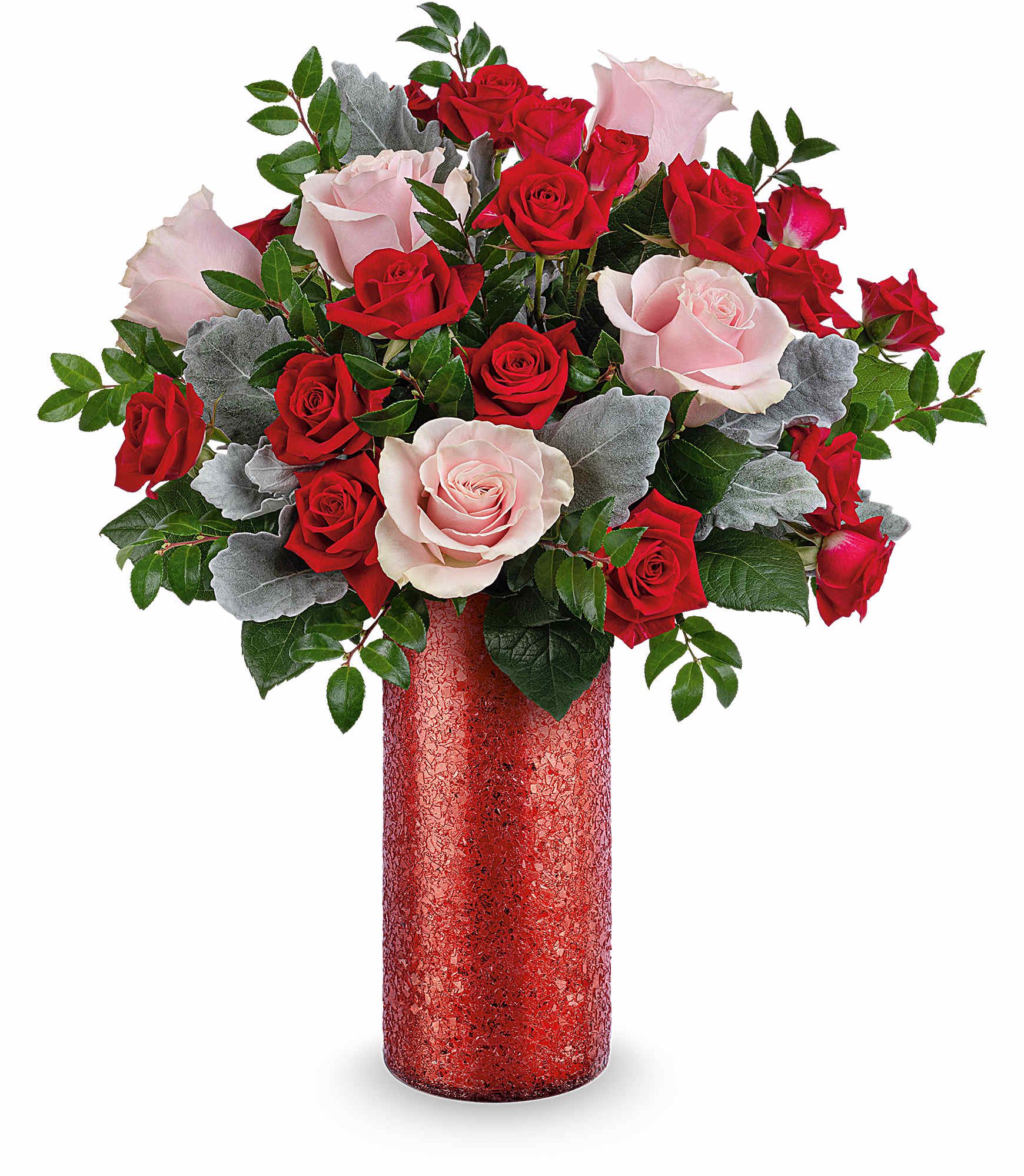 Boldly Beautiful Bouquet - Make a stunning statement this Valentine's Day with Teleflora's Boldly Beautiful Bouquet-a modern mix of pink roses and red spray roses arranged in a dazzling red sparkle glass vase that radiates passion and confidence. Teleflora's Boldly Beautiful Bouquet includes pink roses, red spray roses, dusty miller, and huckleberry, beautifully arranged in Teleflora's Boldly Beautiful Vase. Approximately 16" W x 18 1/2" H 