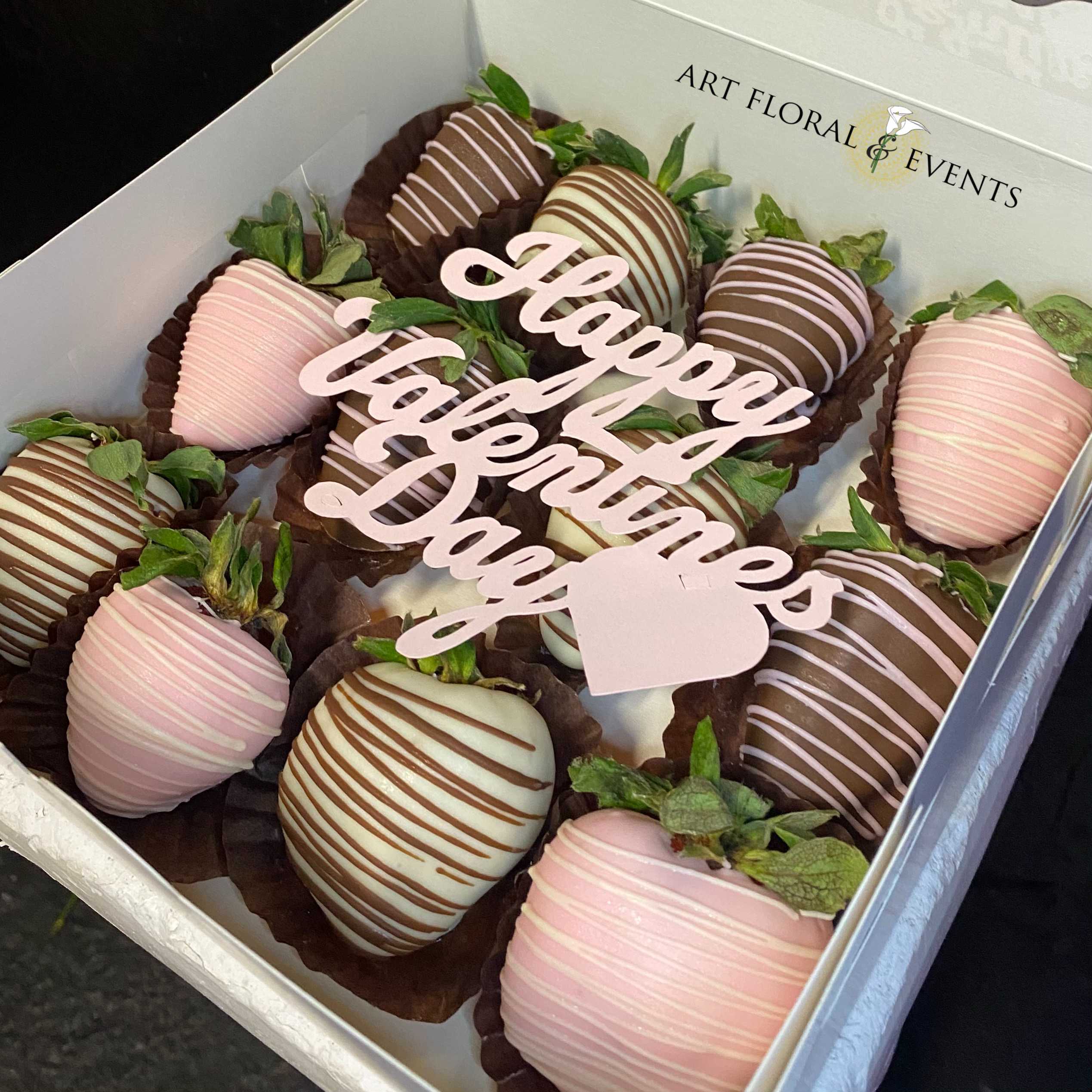 Valentines Day Chocolate Covered Strawberries - *DISCLAIMER PLEASE READ** IF THIS ORDER IS PLACED FOR DELIVERY WE ARE NOT LIABLE FOR ANY MELTING OR ANY OTHER FORM OF PERISHMENT OF THE PRODUCT all deliveries made to homes are left at the door whether the recipient is home or not.  This order includes 12 Chocolate Covered Strawberries Adorned in a box, with a decorative Valentines day sign.   *This product is only available for Valentines Day *