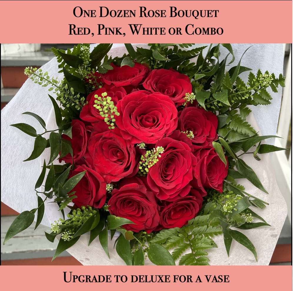 One Dozen Rose Bouquet - Red, Pink, White or Combo - One dozen premium roses with greens and delicate accents for a timelessly elegant look. Let us know in the notes if you would like red, pink, white or a combo. If not indicated we will assume red. This is a bouquet, it will be wrapped with a water source to keep it fresh but it does not come in a vase. If you would like a vase please upgrade to deluxe. 