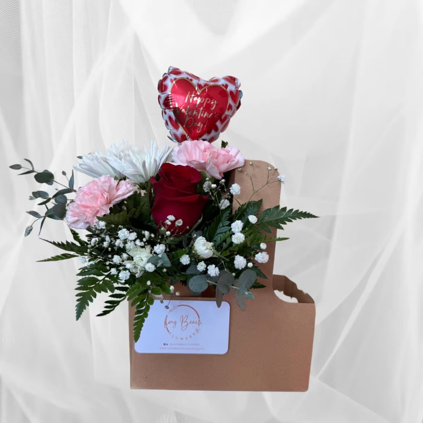 Valentine's Day Themed CarrierValentine's Day Themed Carrier - Flower selection or balloon may differ. Add your preferred drink to the carrier (DRINK NOT INCLUDED).