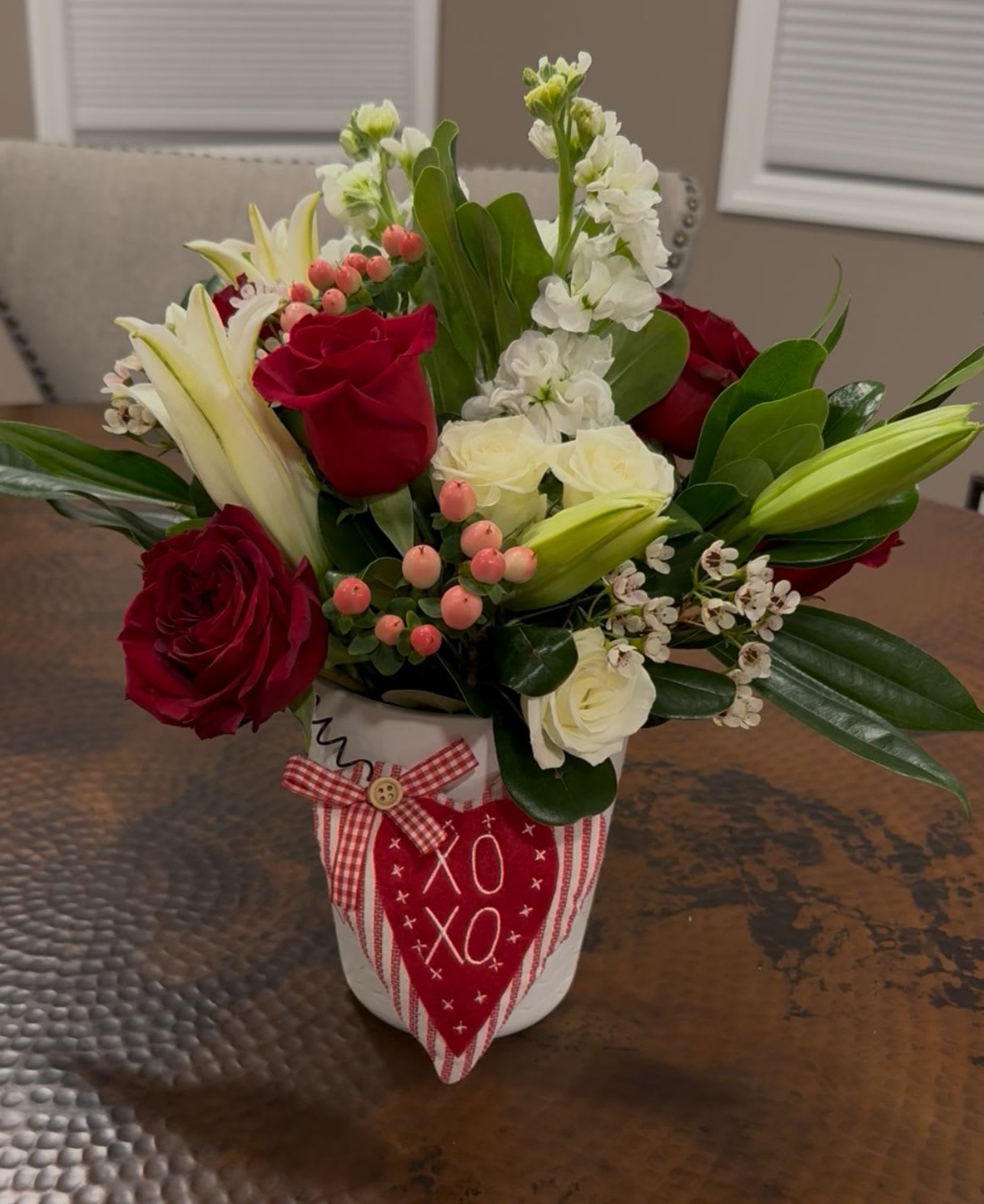Queen of hearts - These beautiful heart roses will stand out with the contrasting white lilies, stock and spray roses.This arrangement is sure to please that special someone on valentine's day!