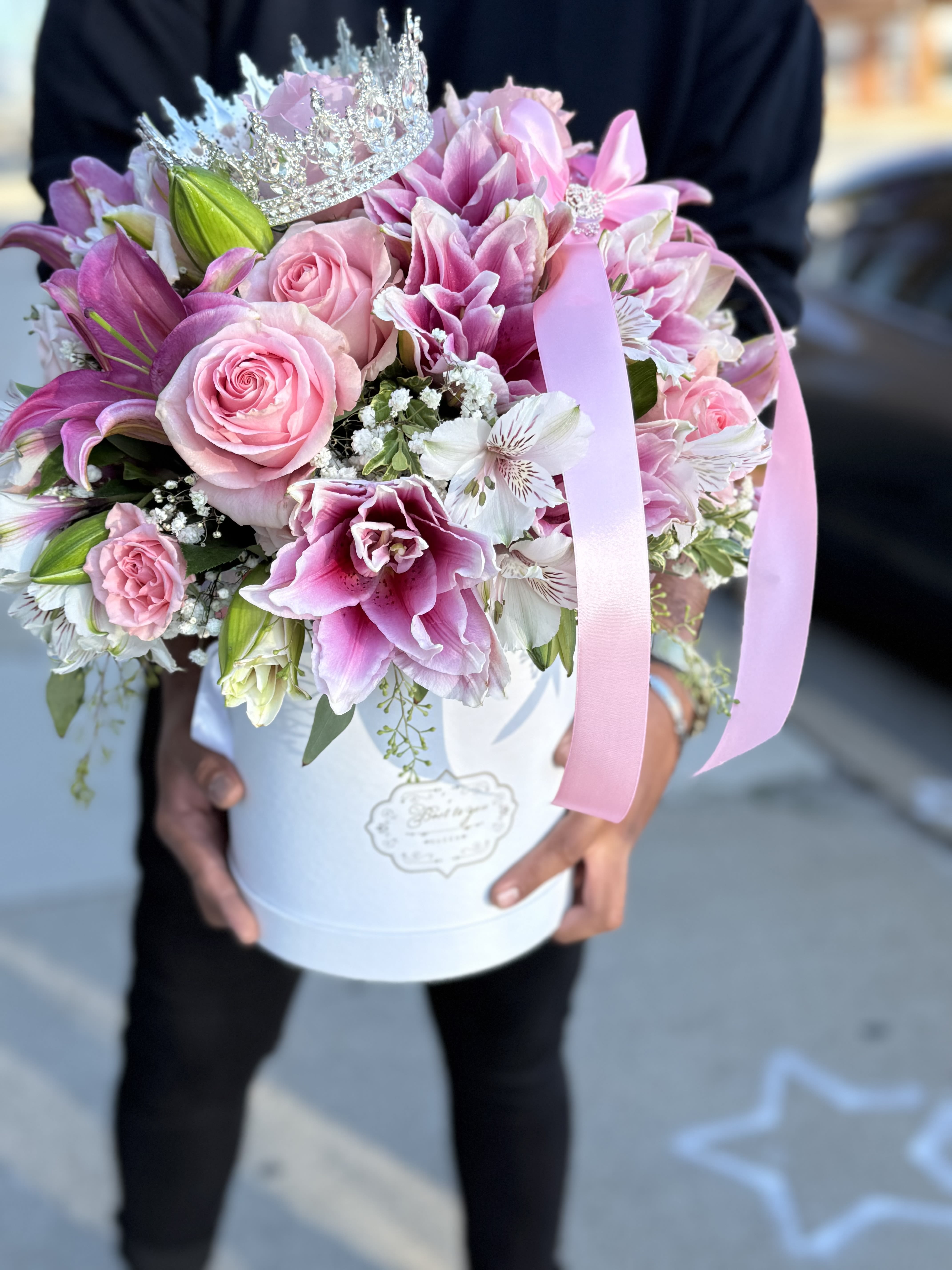 Fit For a Princess    - Beautiful pink lilies, roses, spray roses, babies breath and white alstro. Paired with pink ribbon, a white box and a crown.  Perfect fit for a perfect gift for a princess.