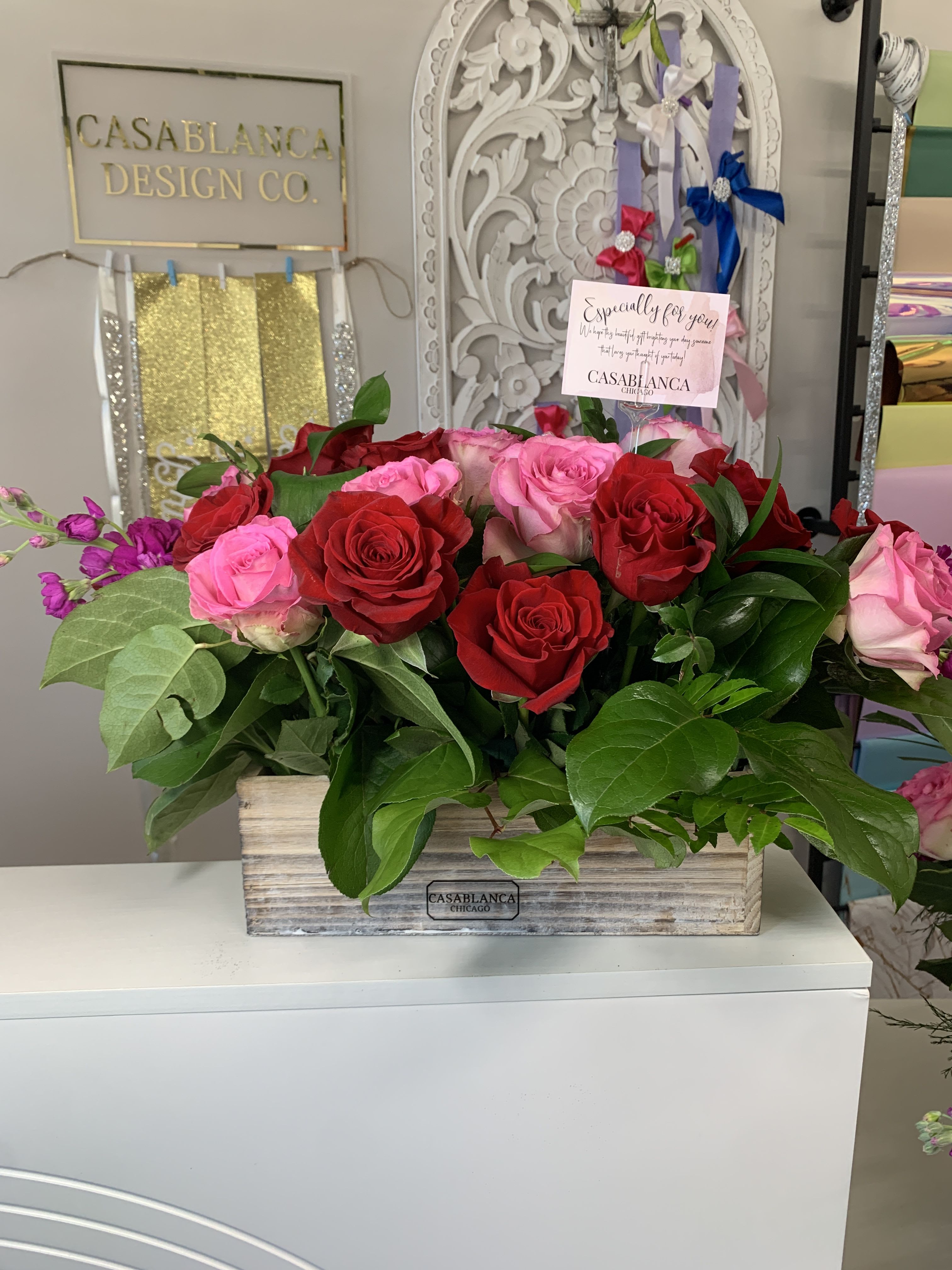 Mixed Berry Into You Centerpiece  - Red and hot pink roses in a short wooden box. Perfect to take over her island or table. Little bit of romance, little bit of excitement! 