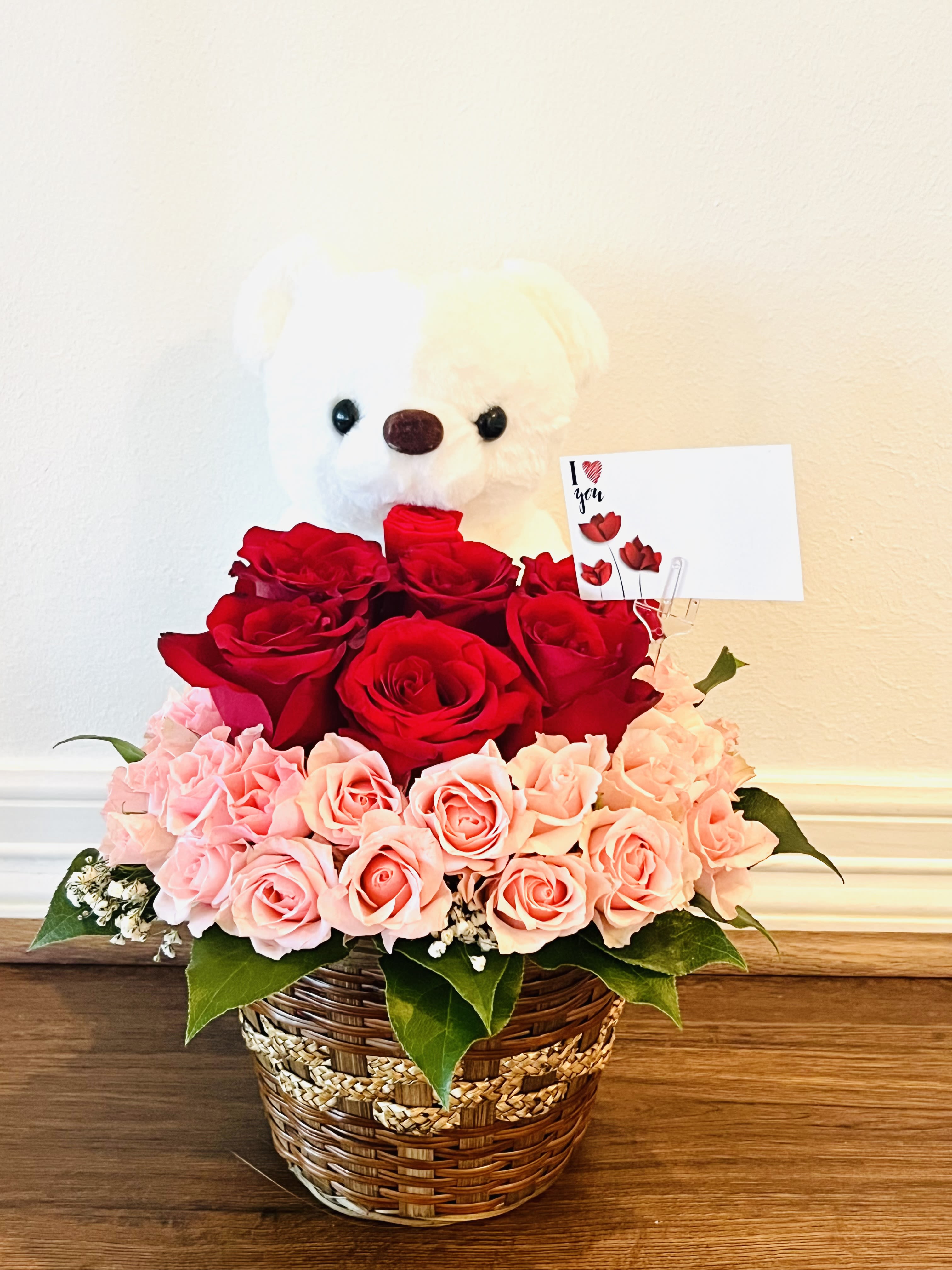 Be mine ! - Premium roses in an adorable teddy bear basket  is all you need for valentines.Created in a wicker basket with premium roses , this basket is sure to win hearts.