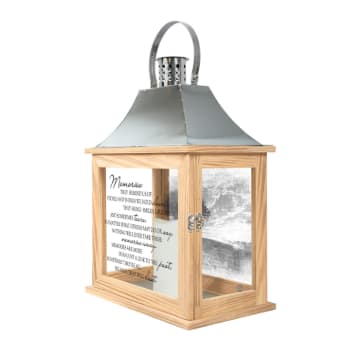 "MEMORIES" MEMORIAL LANTERN - Our Memorial Lanterns are made from quality composite wood and a stainless steel copper finish top. They feature a built-in automatic timer which runs for 6 hours on and 18 hours off. DO NOT use fire burning candles in the lanterns. Suitable for hanging or free-standing use inside or outside. Recommended as an accent in floral arrangements for many occasions! Meant for indoor use. E: 12.25" H: 17" D: 7.125"